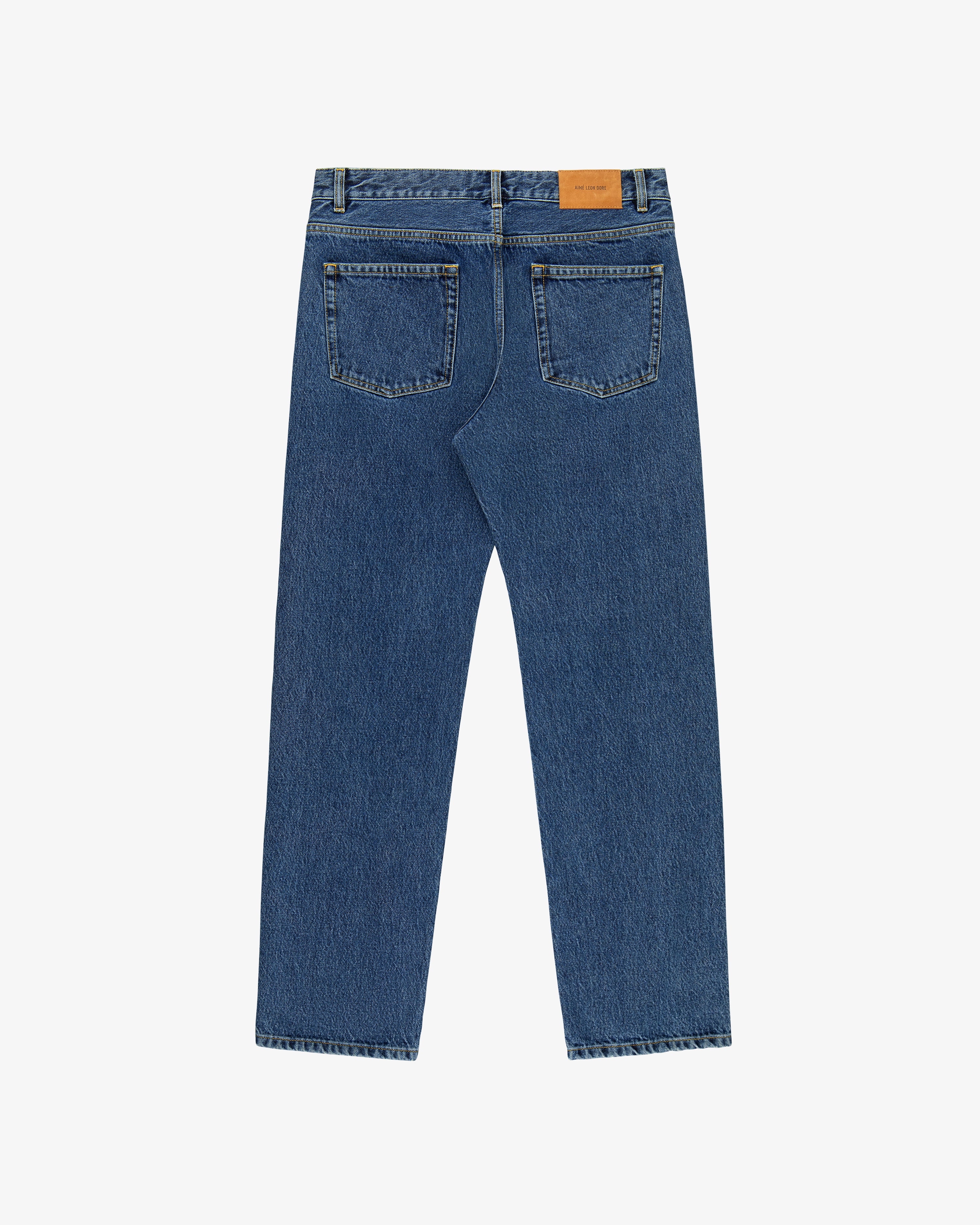 Back view of ALD Straight Fit Denim in blue with two rear pockets and a tan leather waistband patch.