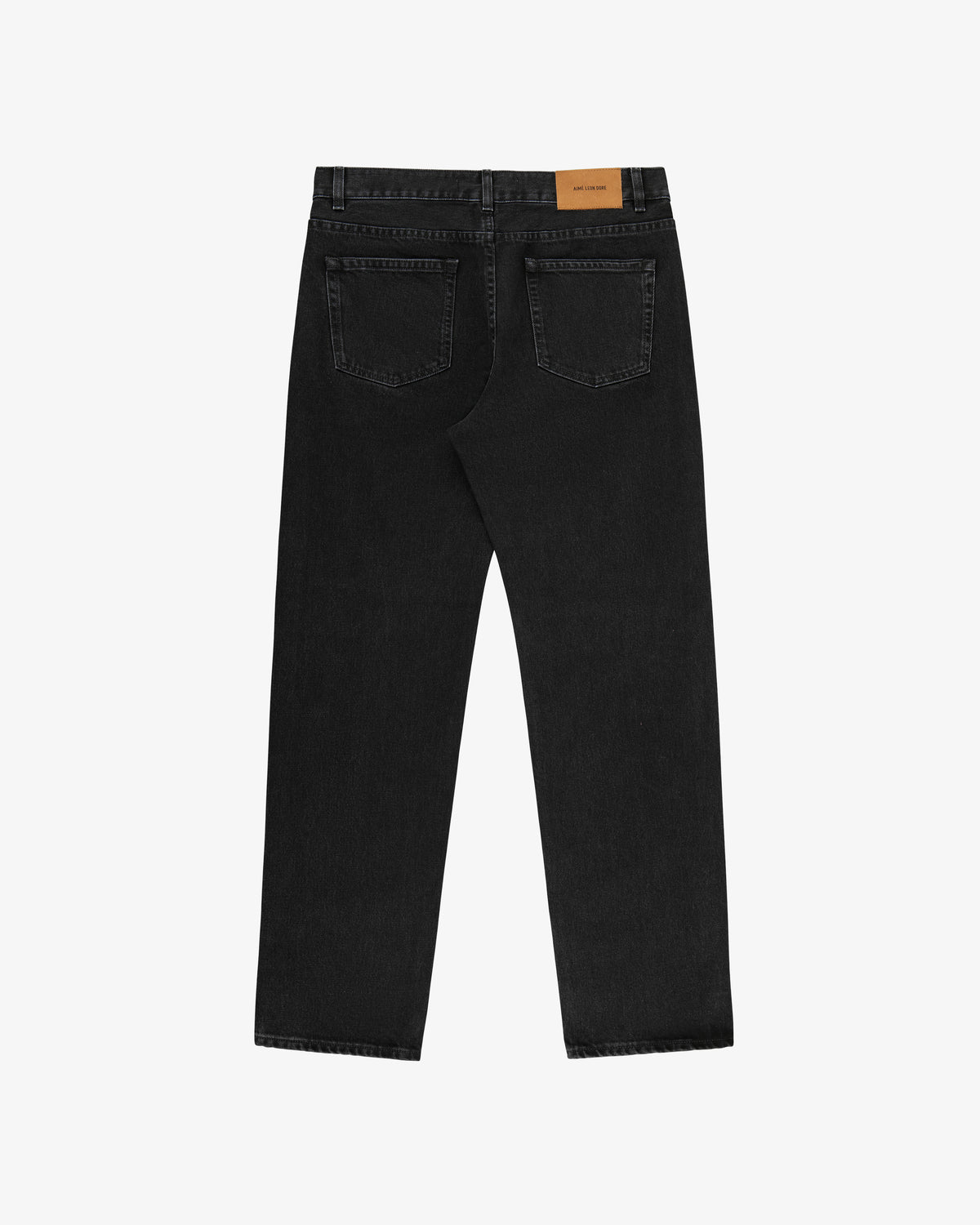Back view of ALD Straight Fit Denim in black with two rear pockets and a tan waistband patch, laid flat on white.