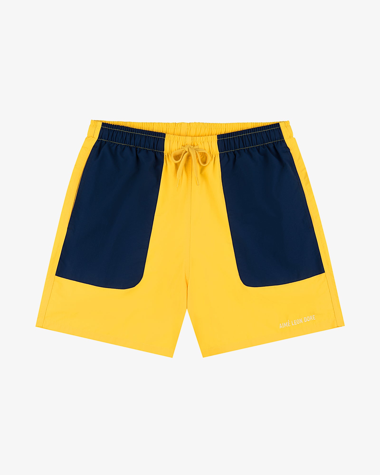 Offshore Swim Short: Yellow with navy front pockets and a drawstring waistband, shown on a white background.