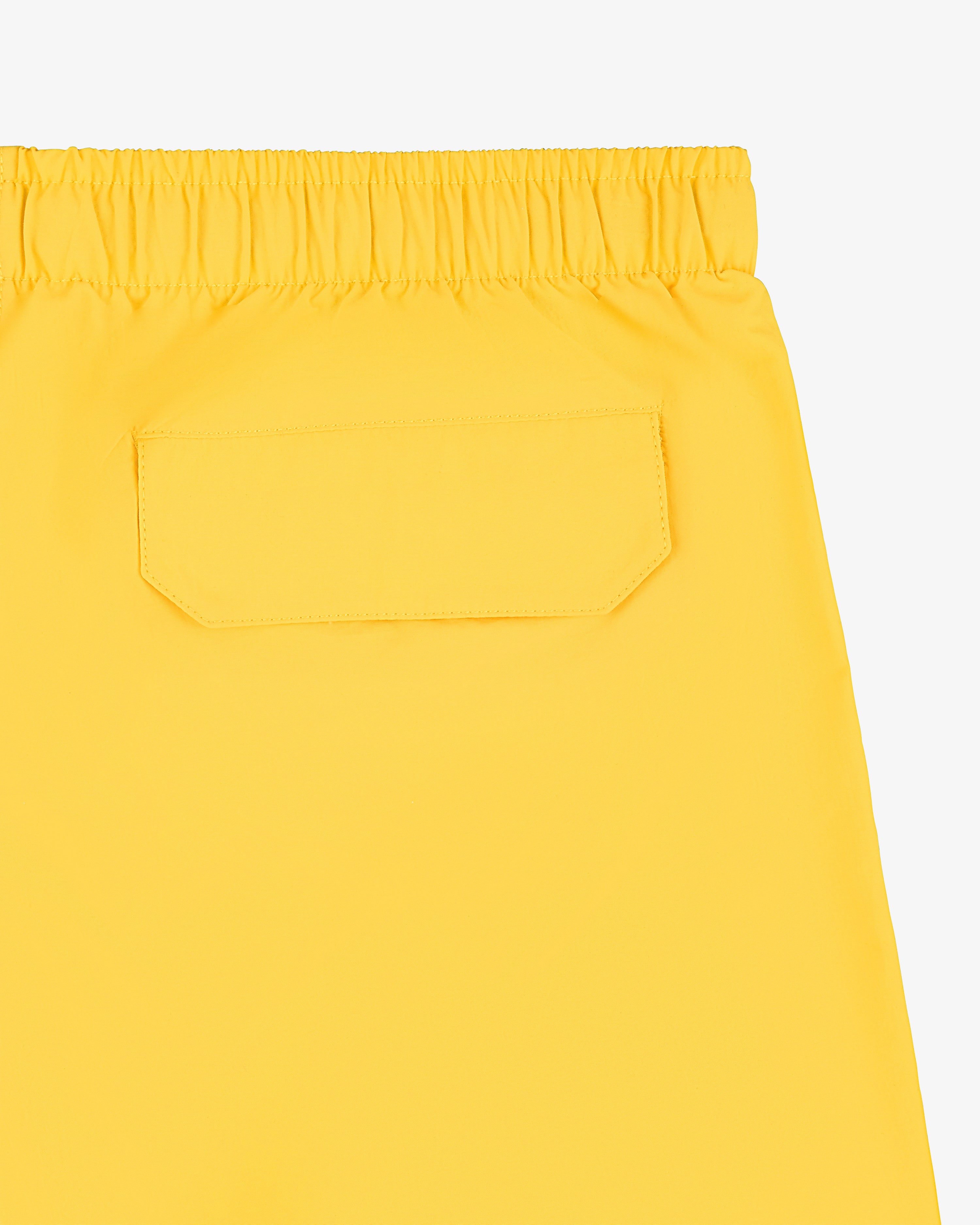 Offshore Swim Short: Yellow, elastic waistband, single back pocket with flap closure.