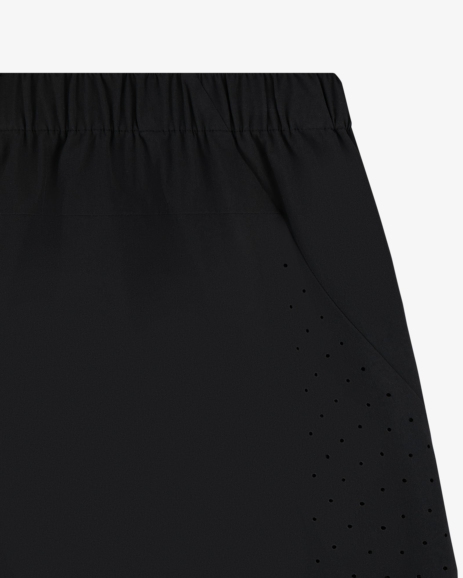 Close-up of ALD Golf Performance Short in black with perforated vents and an elastic waistband.