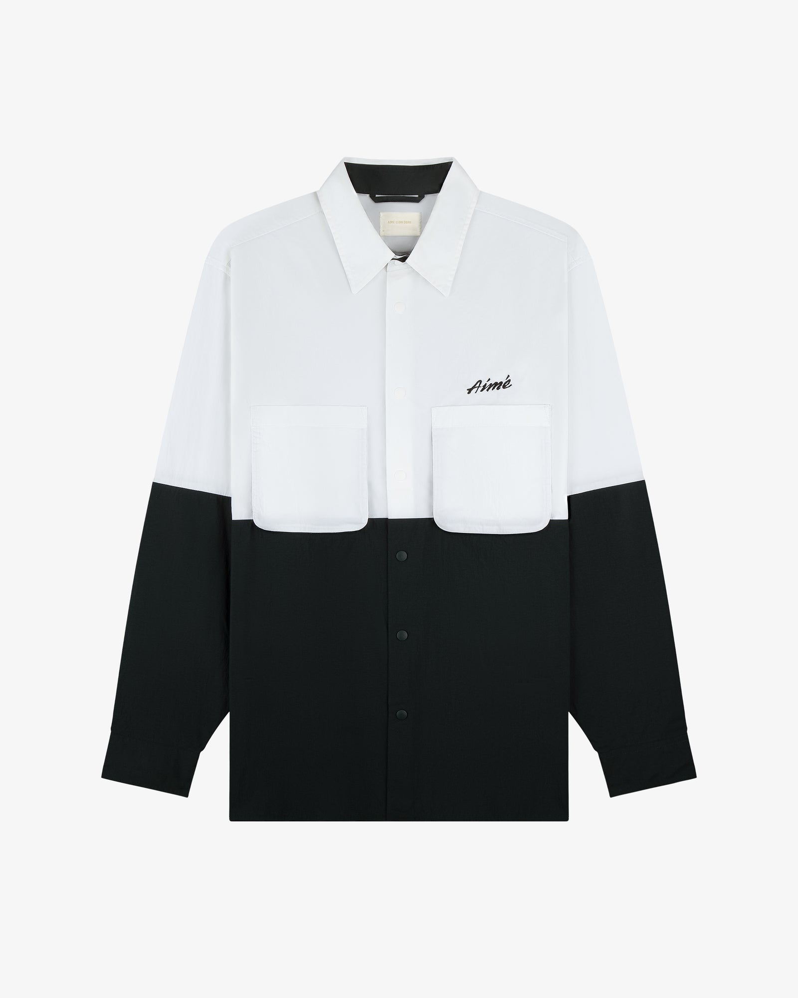 Colorblock Sport Shirt: long-sleeve, white top, black bottom, chest pockets, Aimé logo on the left pocket.