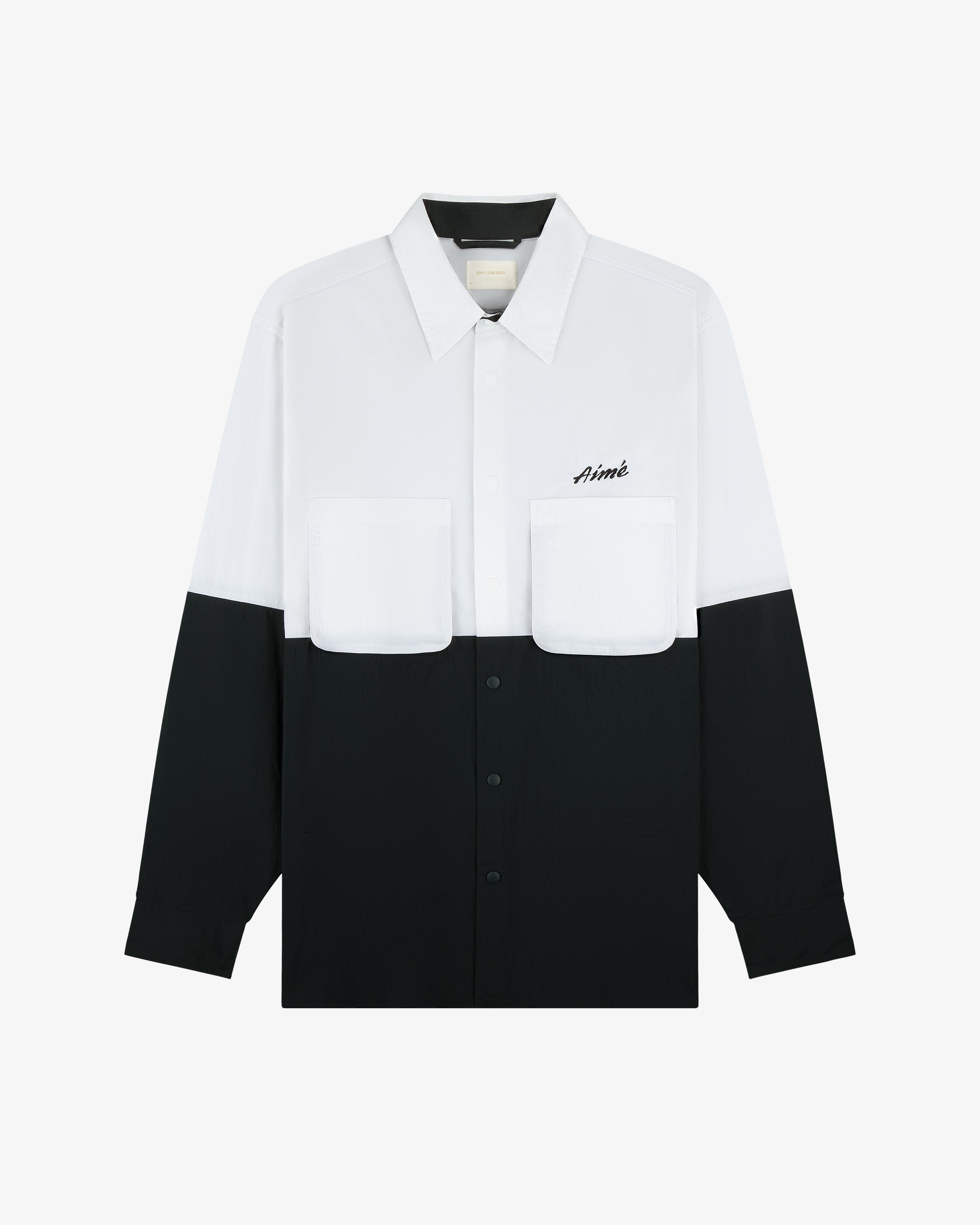 Colorblock Sport Shirt: long-sleeve, white top, black bottom, chest pockets, Aimé logo on the left pocket.