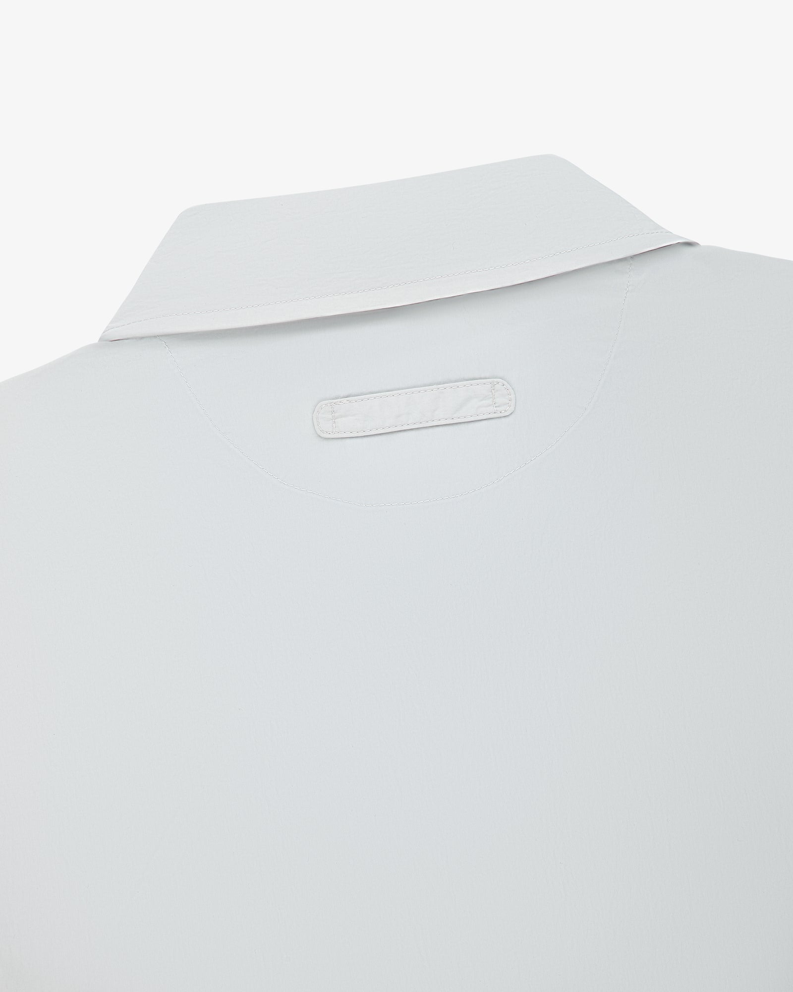 Close-up of the back of the Colorblock Sport Shirt, featuring a small rectangular patch below the collar.