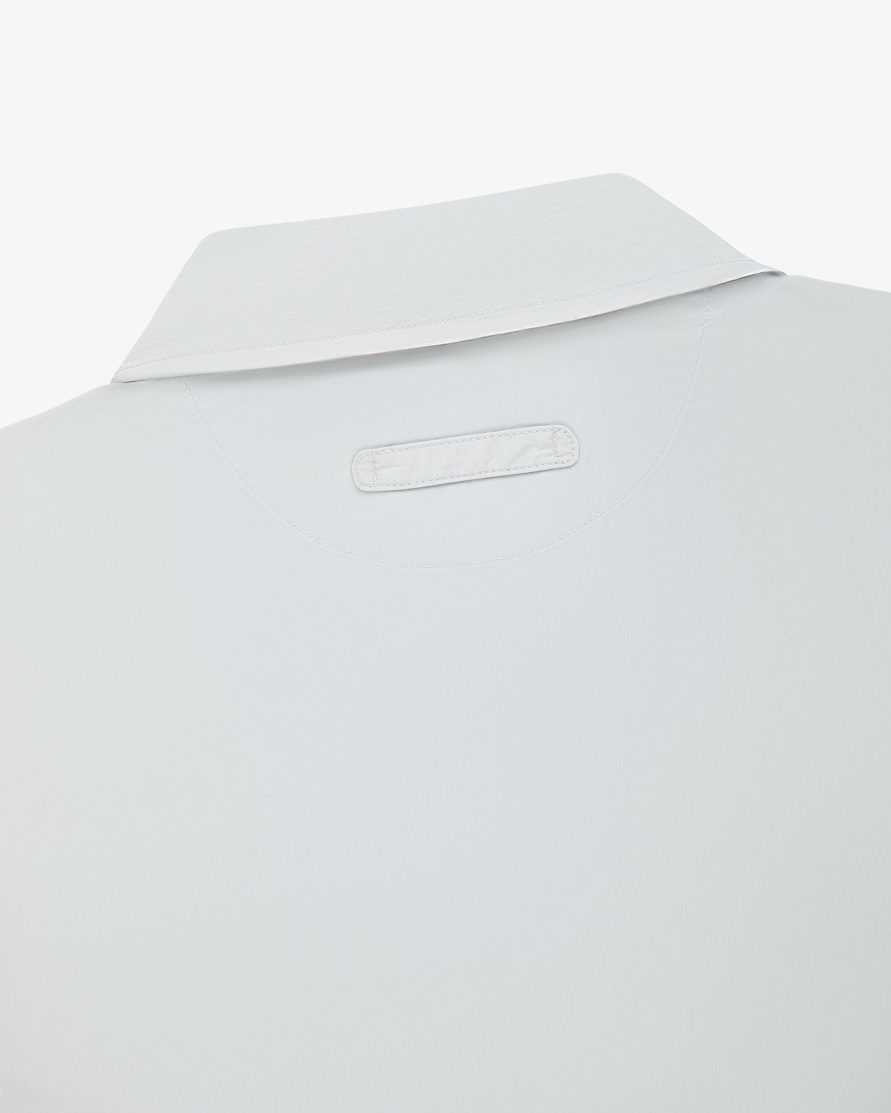 Close-up of the back of the Colorblock Sport Shirt, featuring a small rectangular patch below the collar.