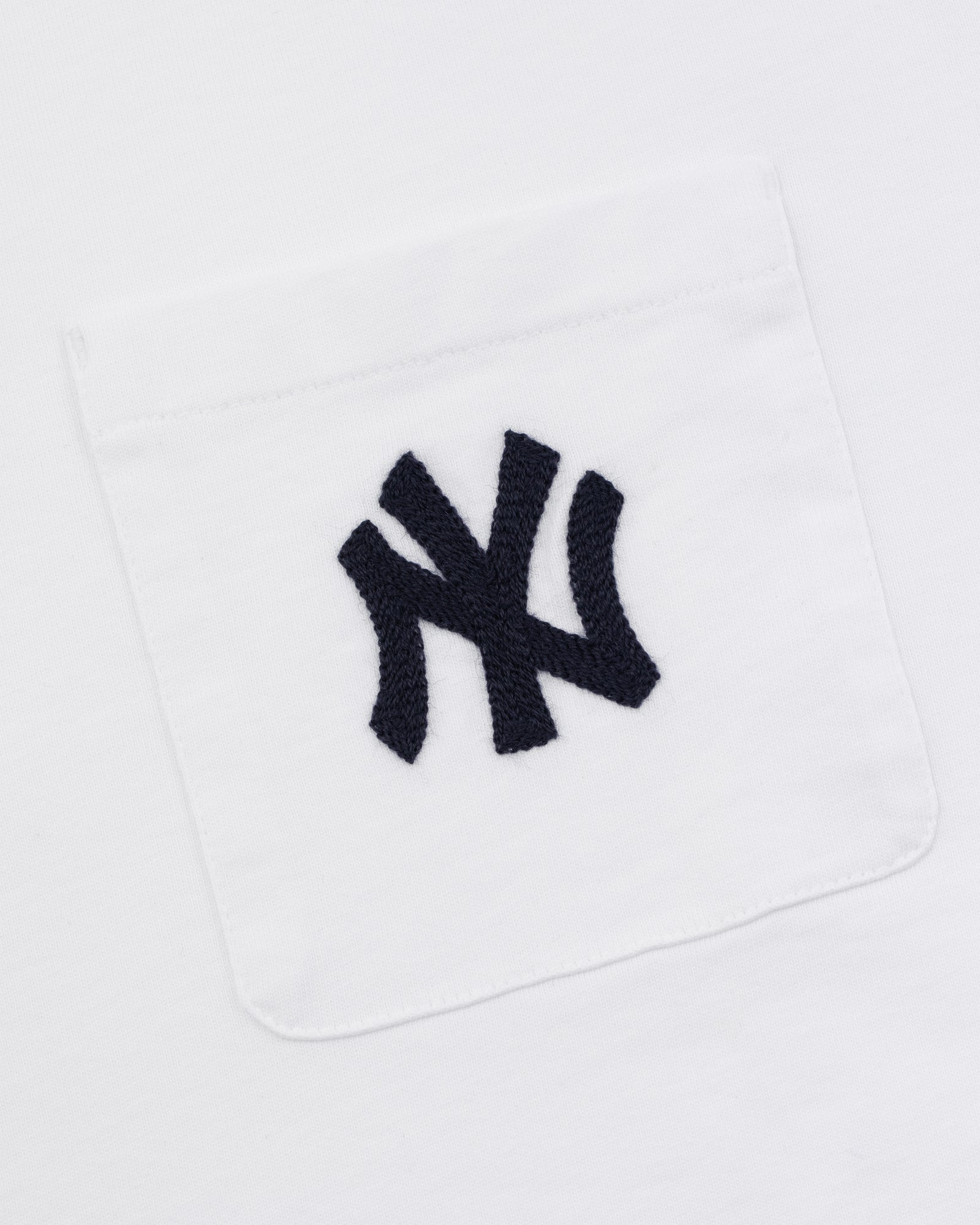 Yankees Chainstitch Pocket Tee featuring a white fabric pocket with a black embroidered Yankees logo on white background.