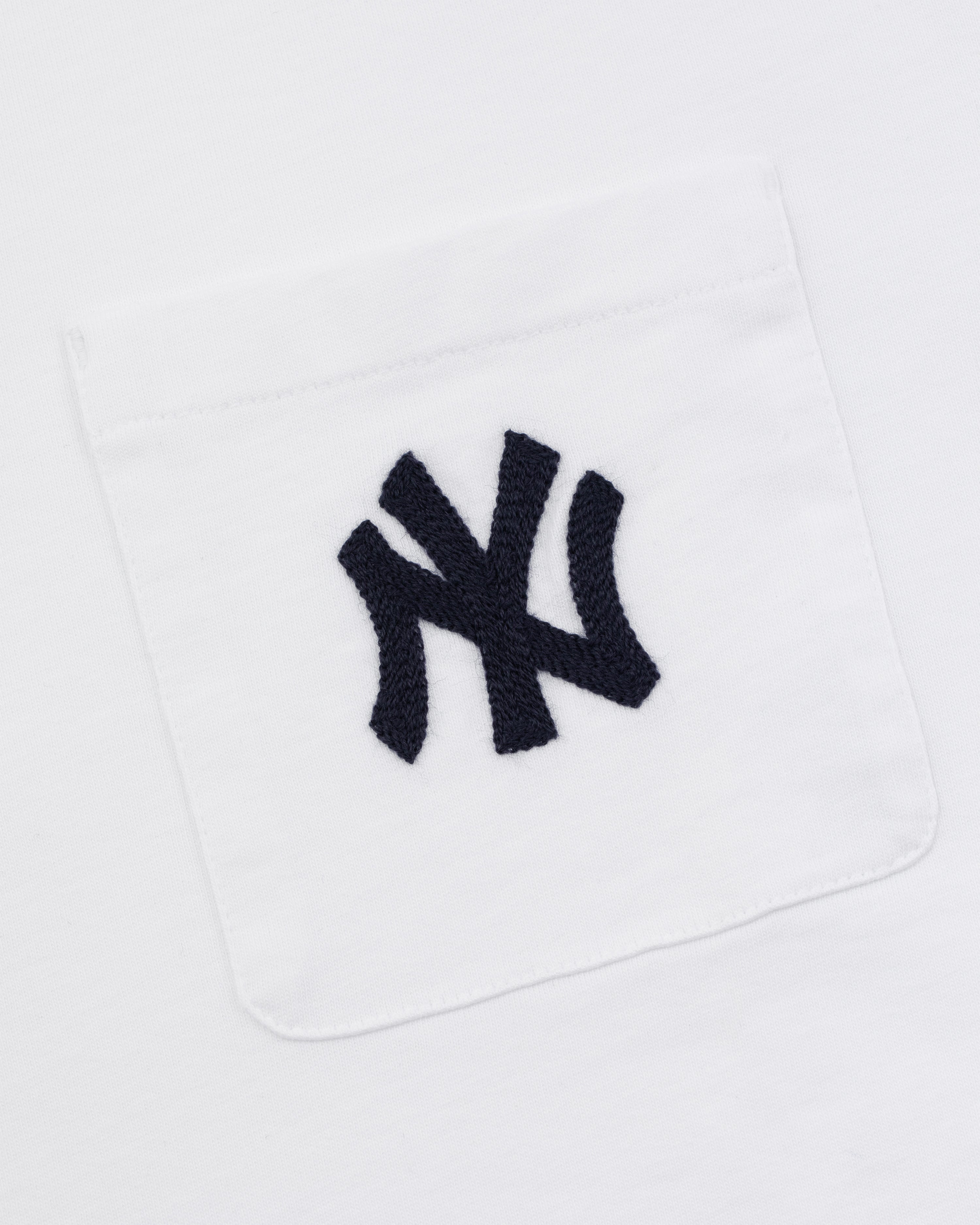 Yankees Chainstitch Pocket Tee featuring a white fabric pocket with a black embroidered Yankees logo on white background.