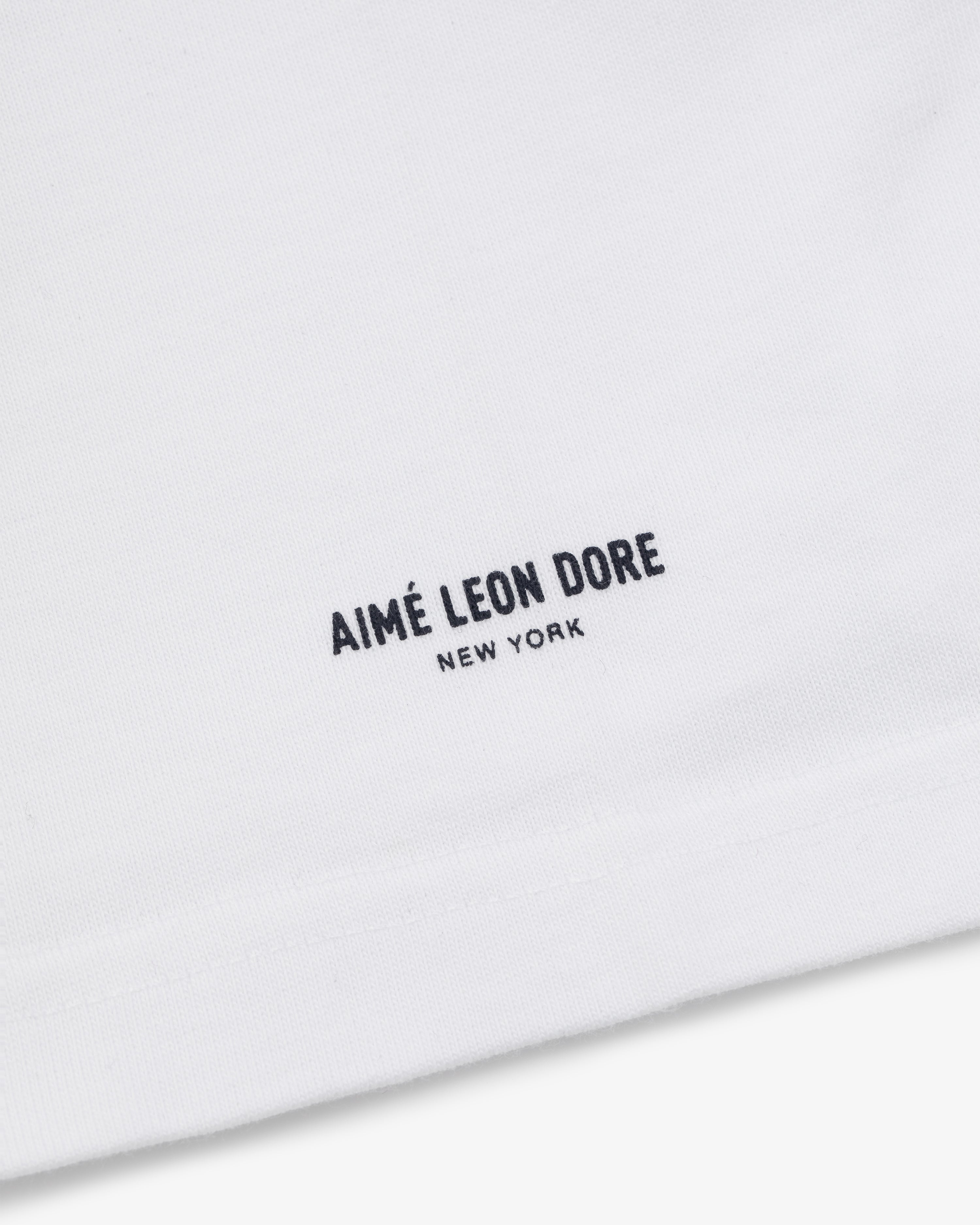 White Yankees Chainstitch Pocket Tee with minimalist AIMÉ LEON DORE NEW YORK text in black near the hem.