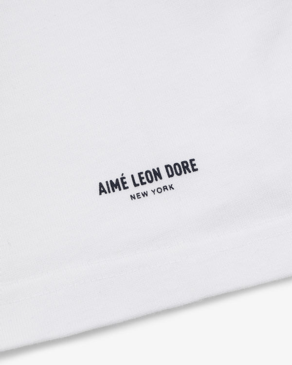 White Yankees Chainstitch Pocket Tee with minimalist AIMÉ LEON DORE NEW YORK text in black near the hem.