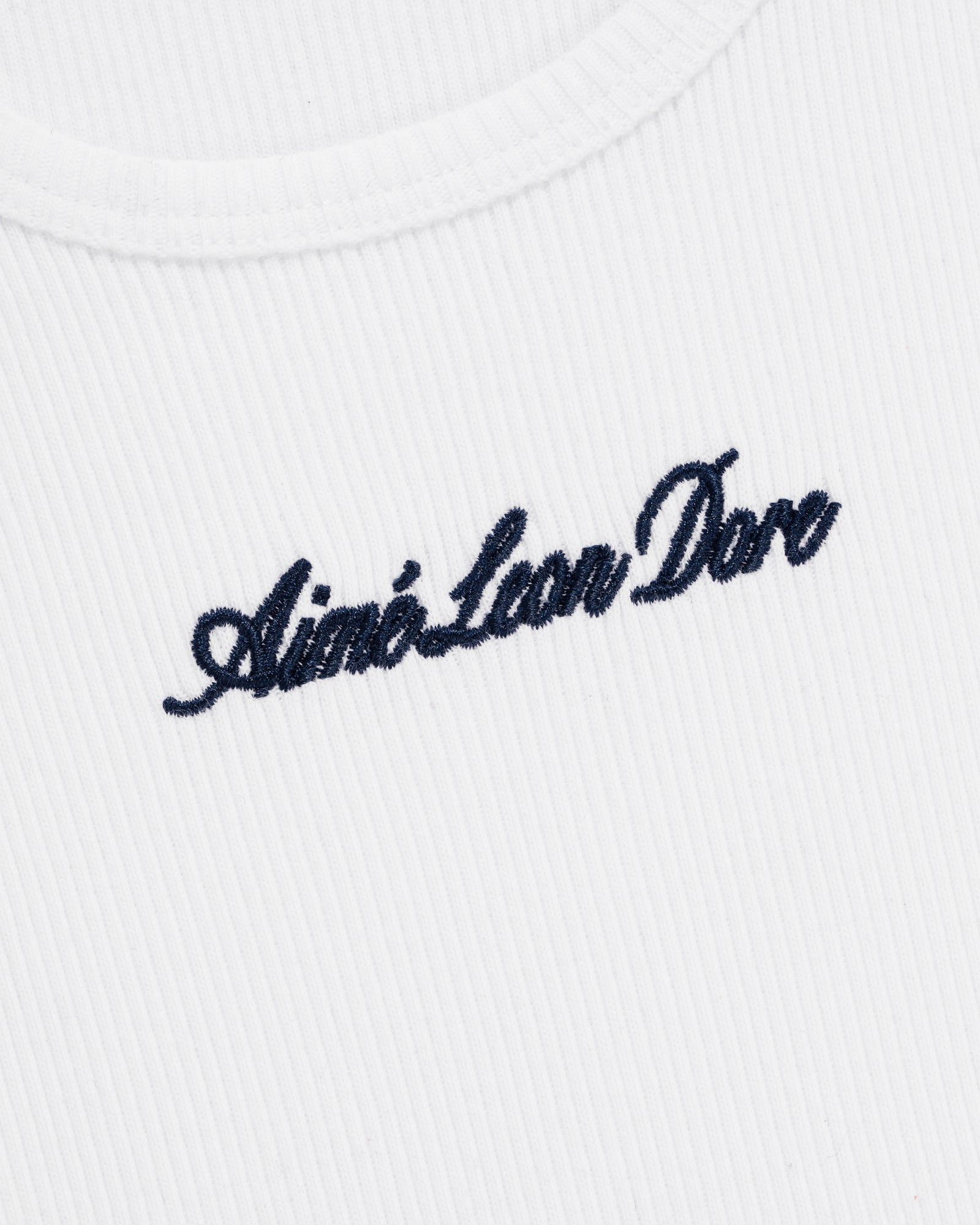 White ribbed Embroidered Logo Tank Top featuring Aimé Leon Dore stitched in black cursive on the chest.