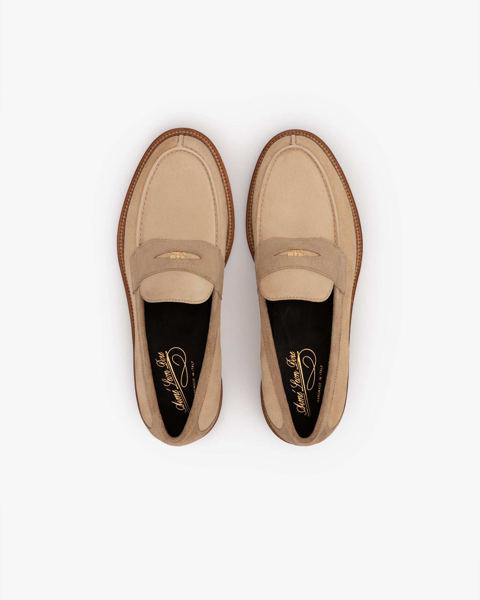 Suede Queens Crest Loafer in beige, brown sole, top view on white background.