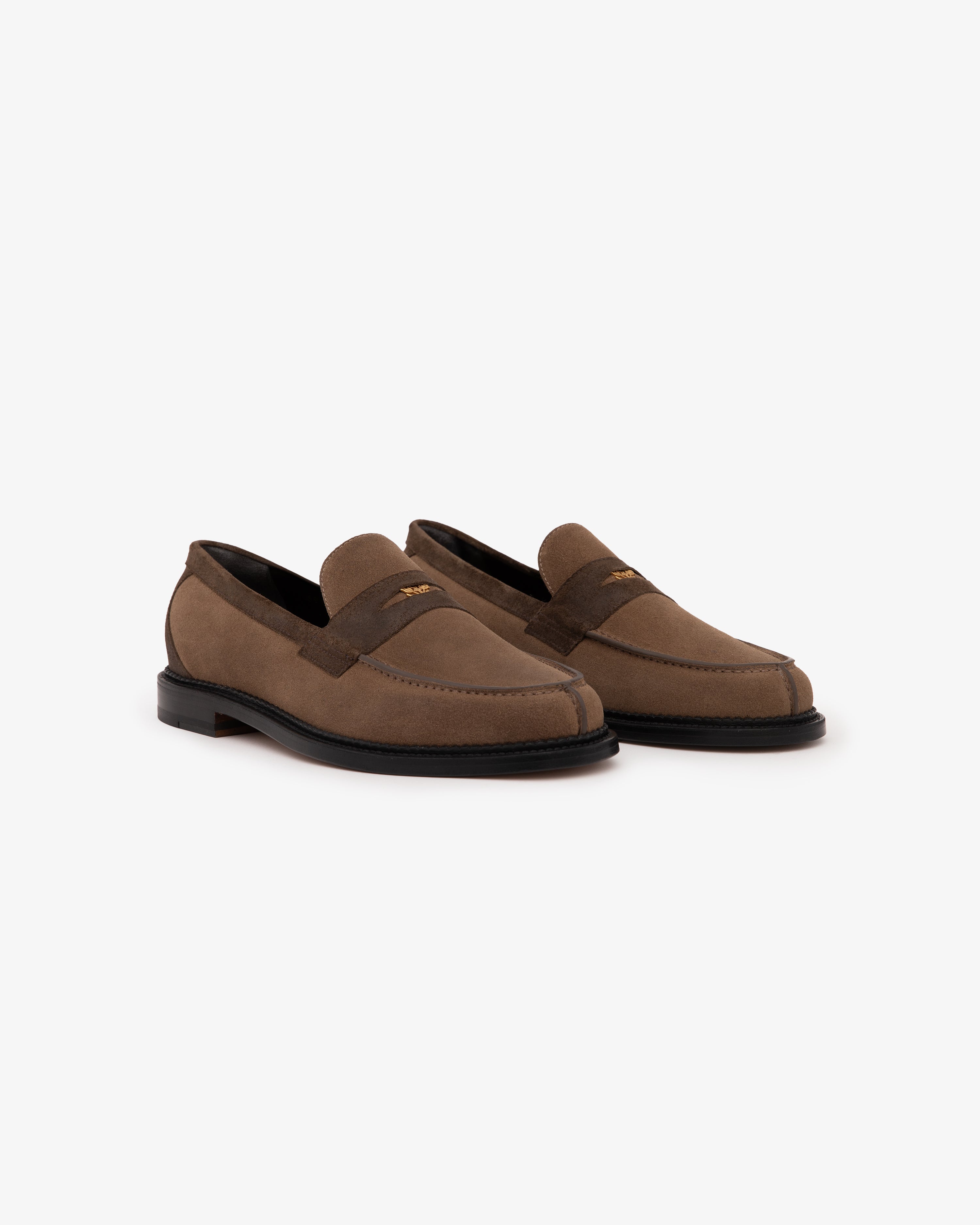 Suede Queens Crest Loafers in brown with black soles, shown side by side on a white background.