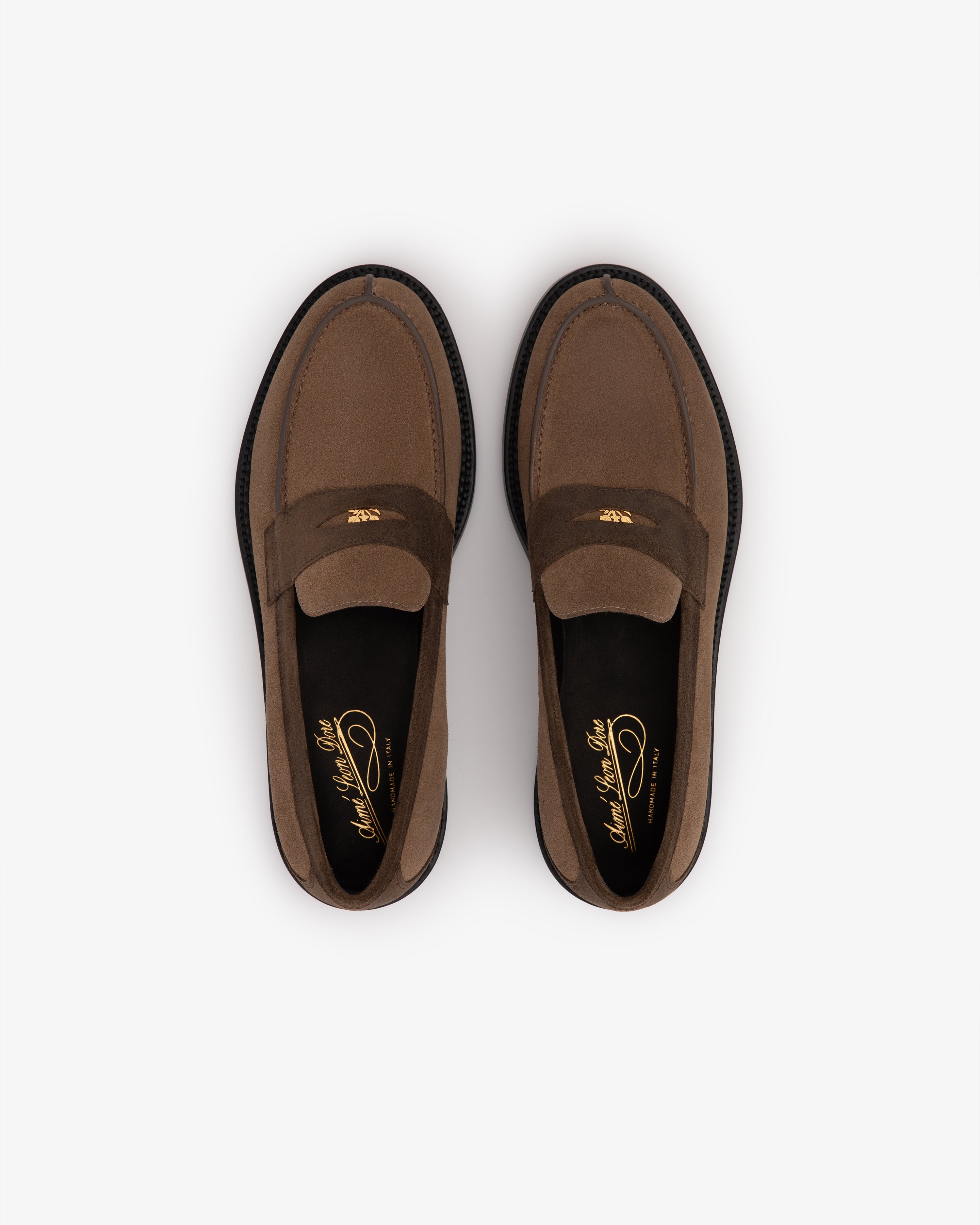 Suede Queens Crest Loafer in brown with black soles, top view, shown on a white background.