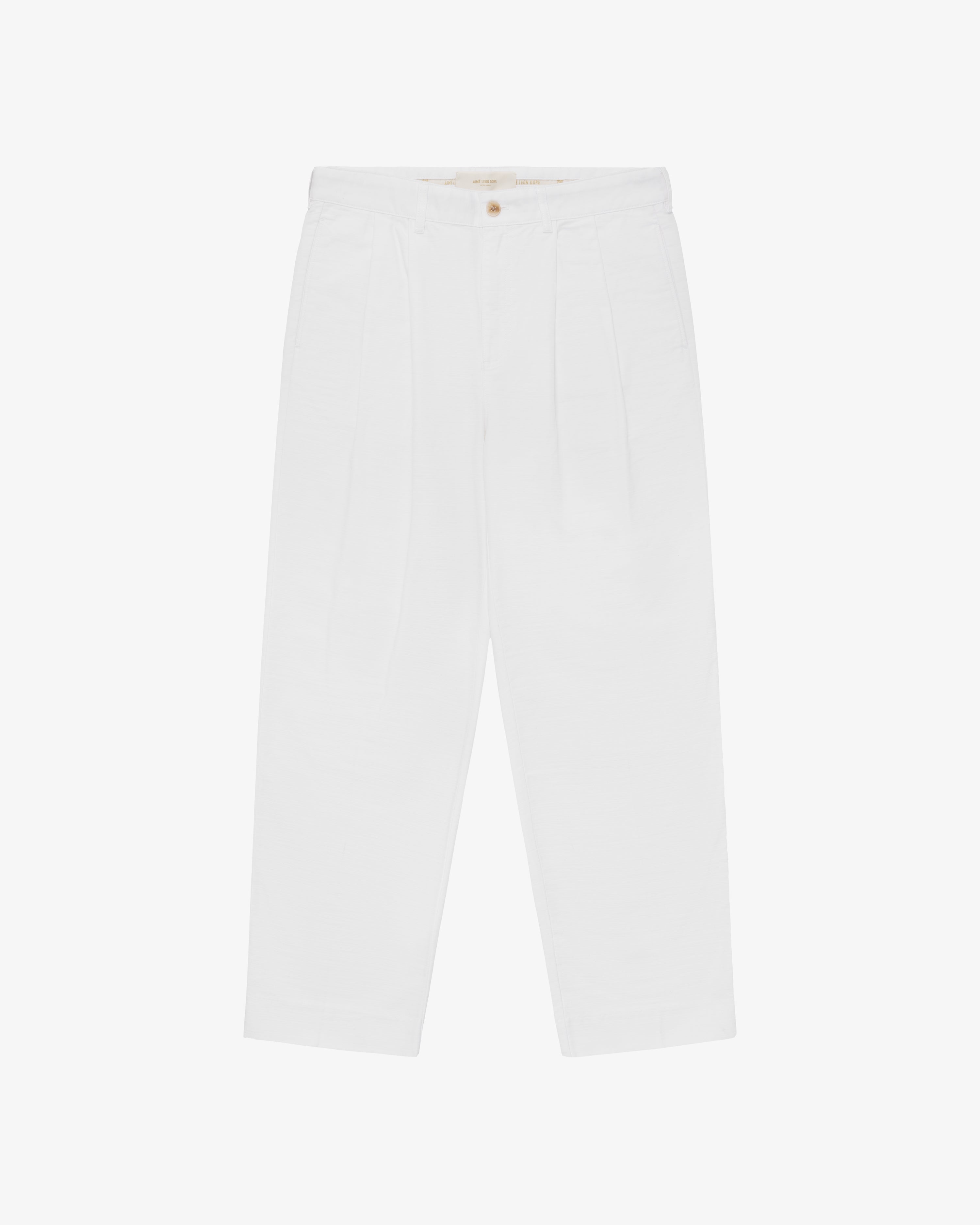 Double Pleated Pant: high-waisted white pants with button closure, shown on a plain white background.