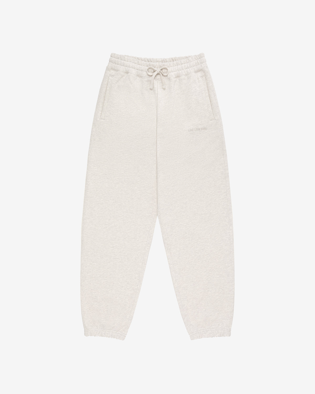 Tonal Logo Sweatpants in light beige with elastic waistband, drawstring, side pockets, and elasticated cuffs.