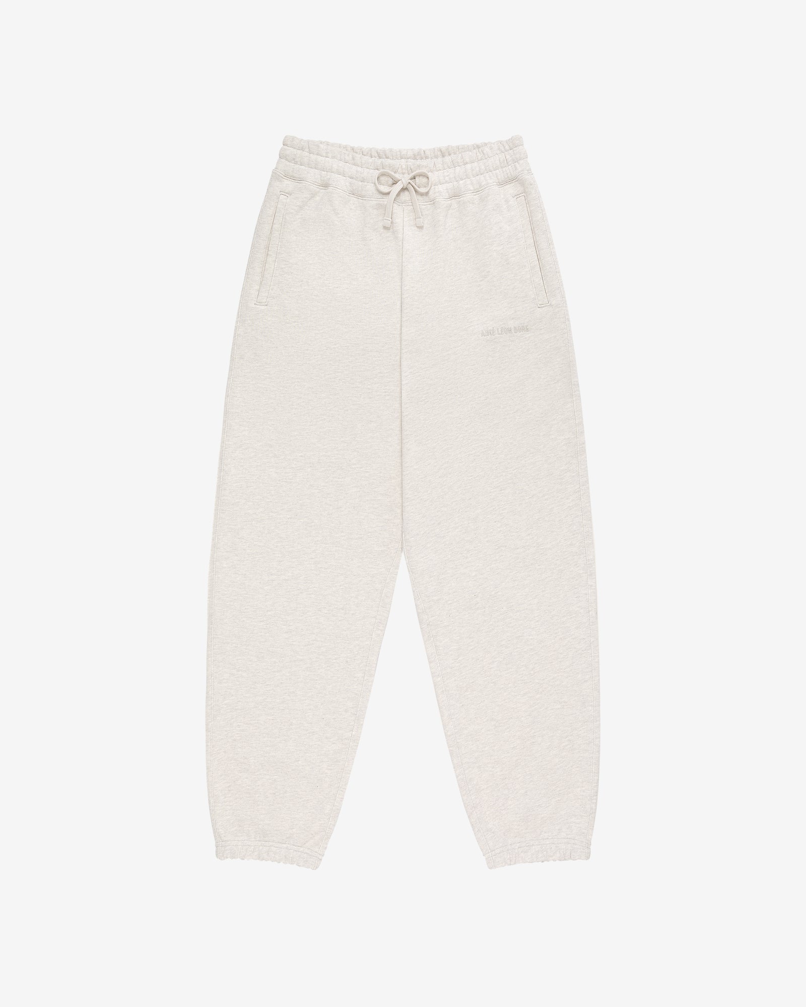 Tonal Logo Sweatpants in light beige with elastic waistband, drawstring, side pockets, and elasticated cuffs.