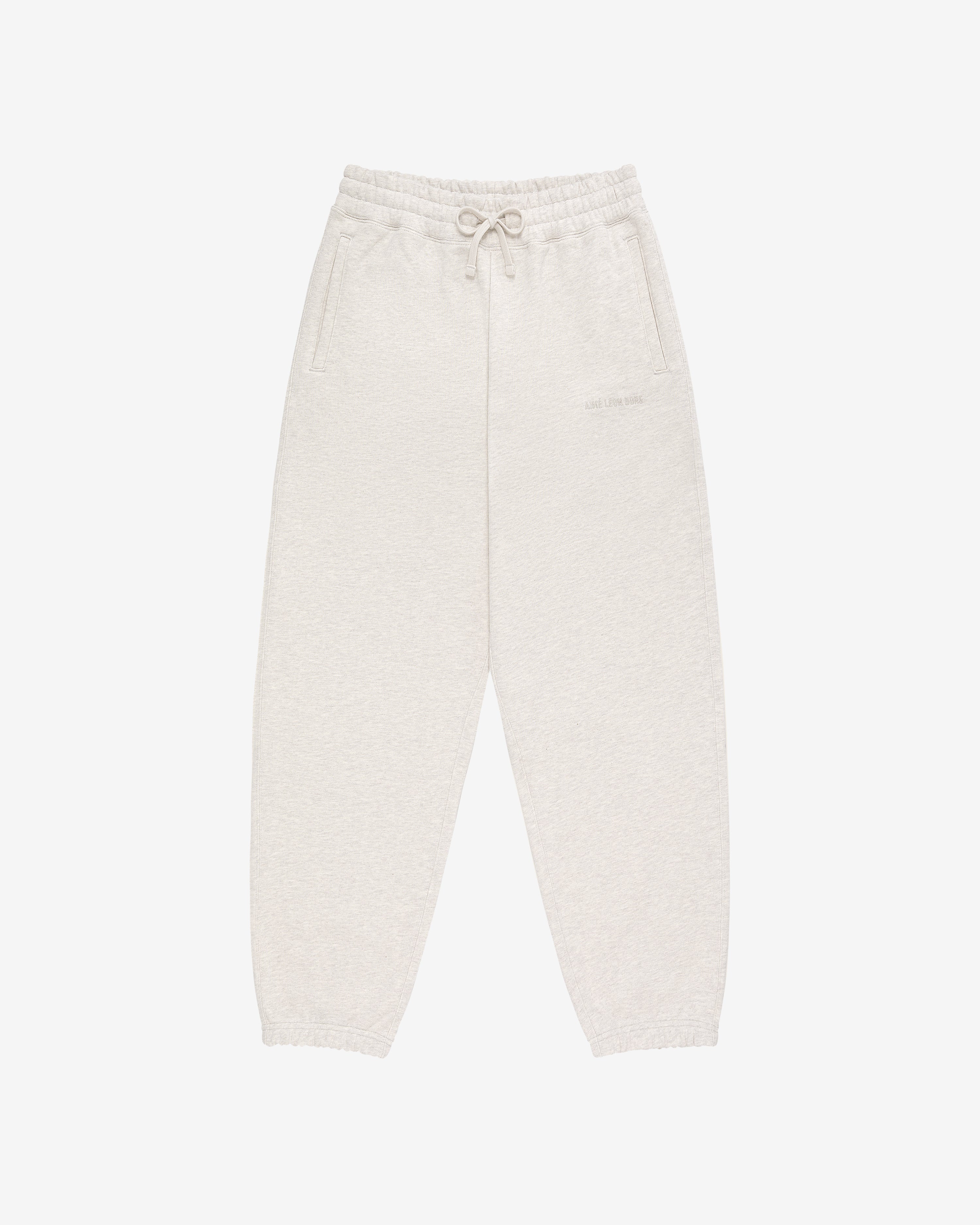 Tonal Logo Sweatpants in light beige with elastic waistband, drawstring, side pockets, and elasticated cuffs.