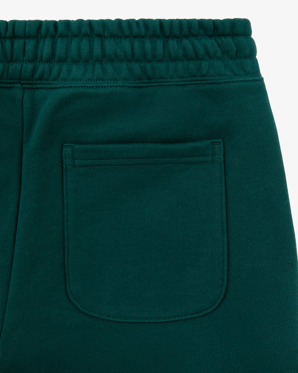Close-up of the back pocket and waistband of Unisphere Sweatpants in dark green with visible stitching details.