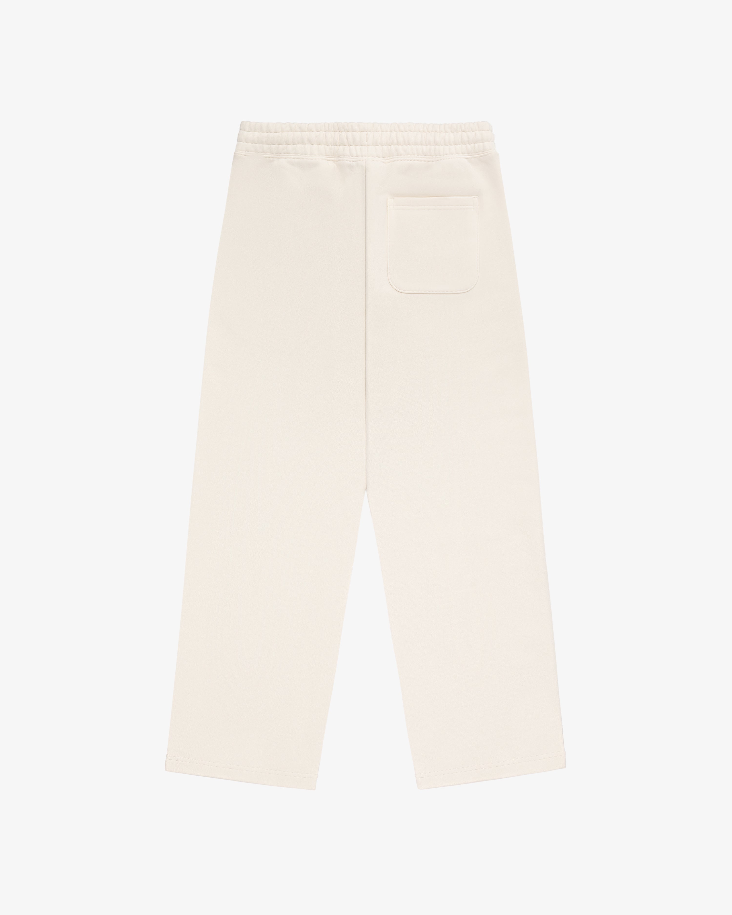 Back view of Unisphere Sweatpants in cream with elastic waistband and single back pocket, laid flat on white background.