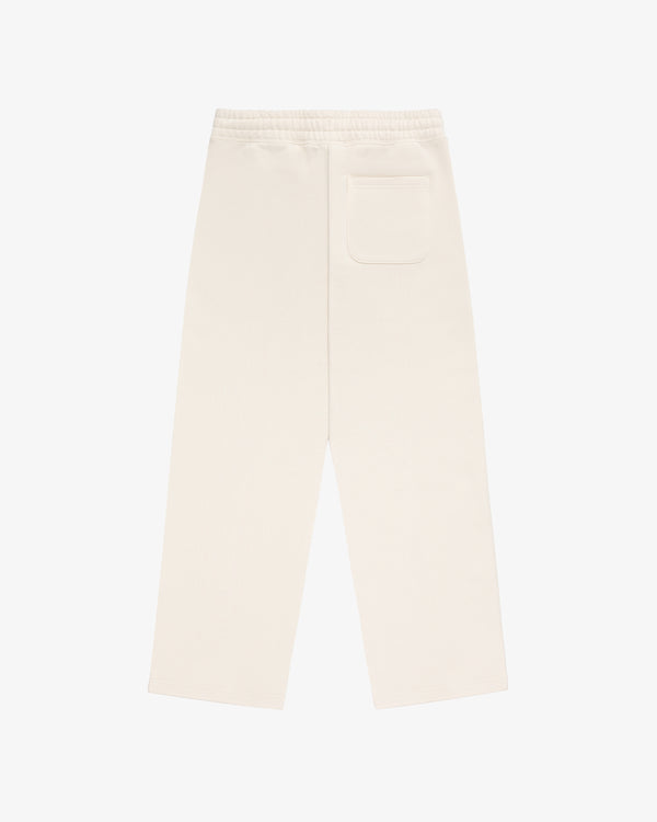 Back view of Unisphere Sweatpants in cream with elastic waistband and single back pocket, laid flat on white background.