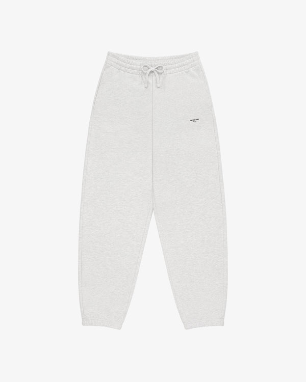 Micro Logo Sweatpants in light gray with elastic waistband, drawstring, and small text logo on the left thigh.