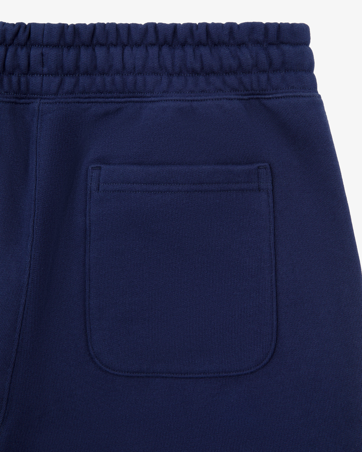 Close-up of the back pocket and elastic waistband on Tonal Logo Sweatpants.