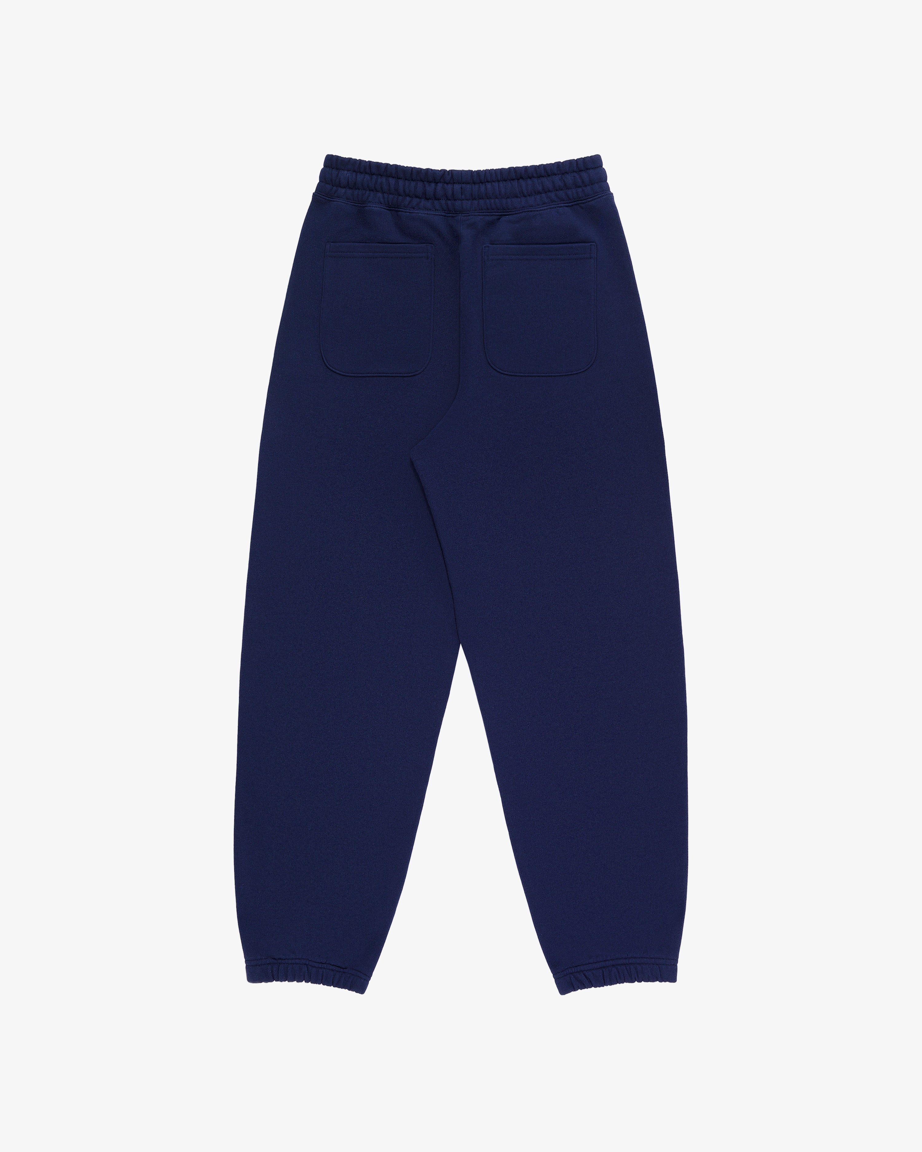 Tonal Logo Sweatpants in navy blue with elastic cuffs, waistband, and two back pockets shown from the back.