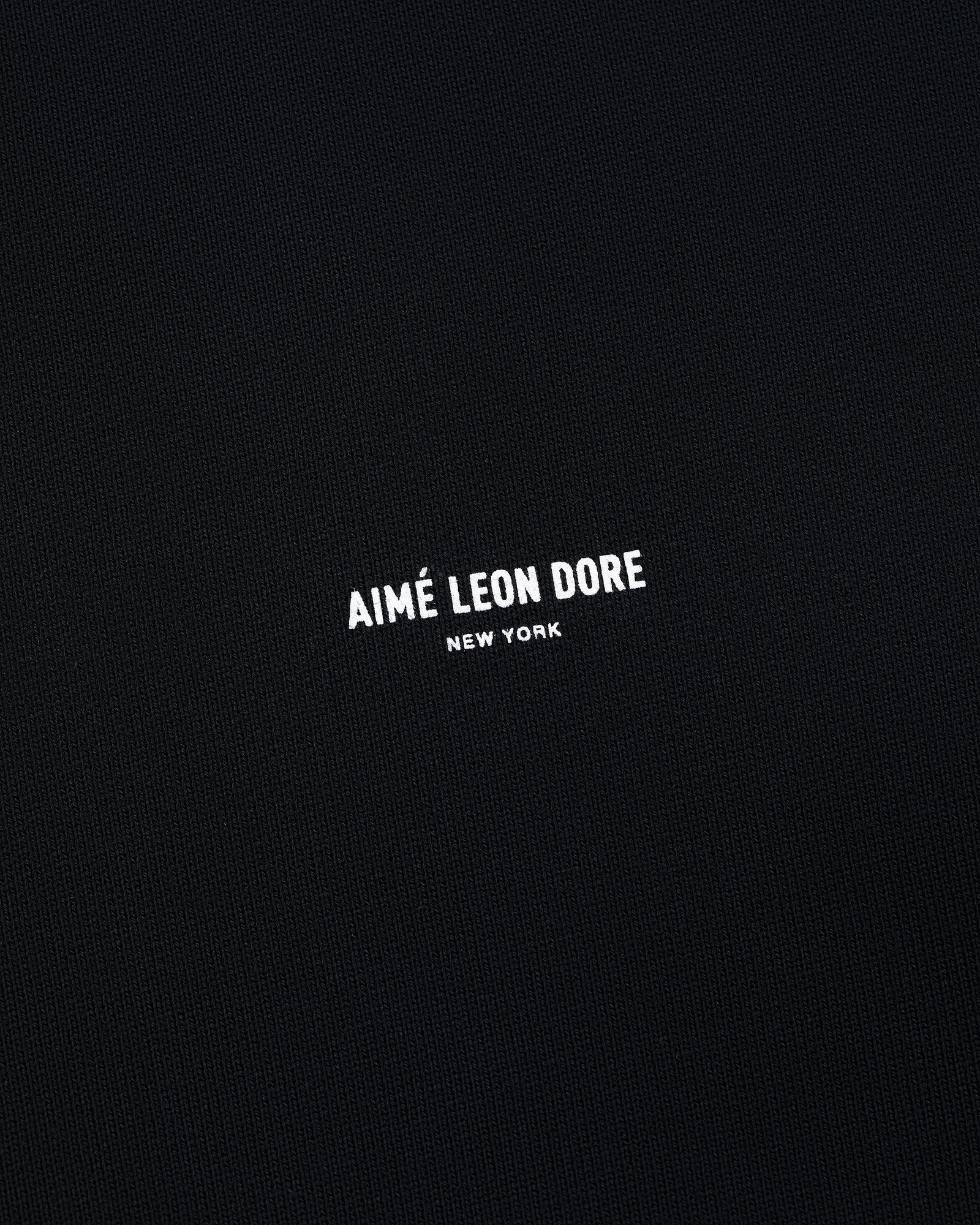 Black Micro Logo Crewneck Sweatshirt with small white AIMÉ LEON DORE NEW YORK text centered on front.