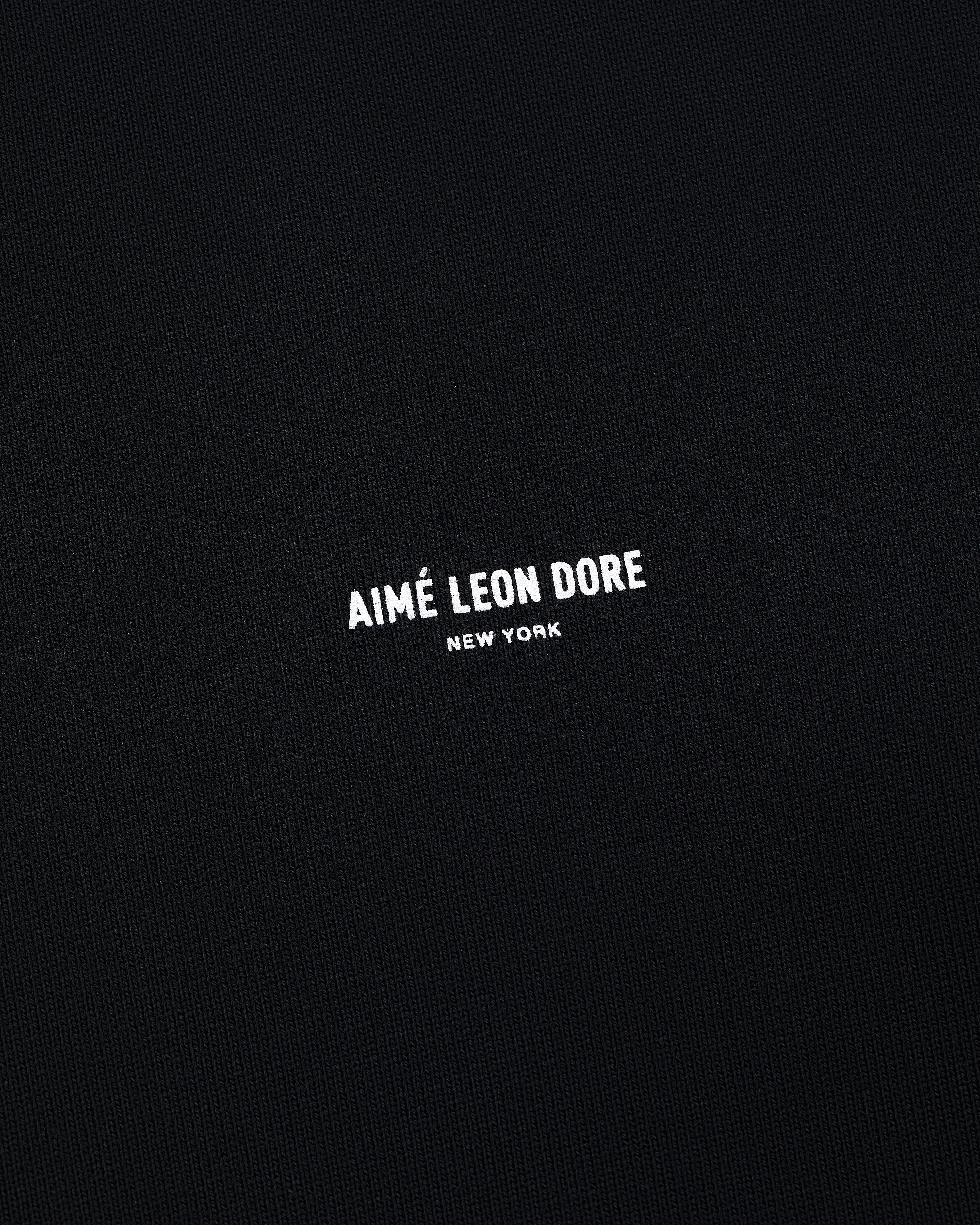 Black Micro Logo Crewneck Sweatshirt with small white AIMÉ LEON DORE NEW YORK text centered on front.