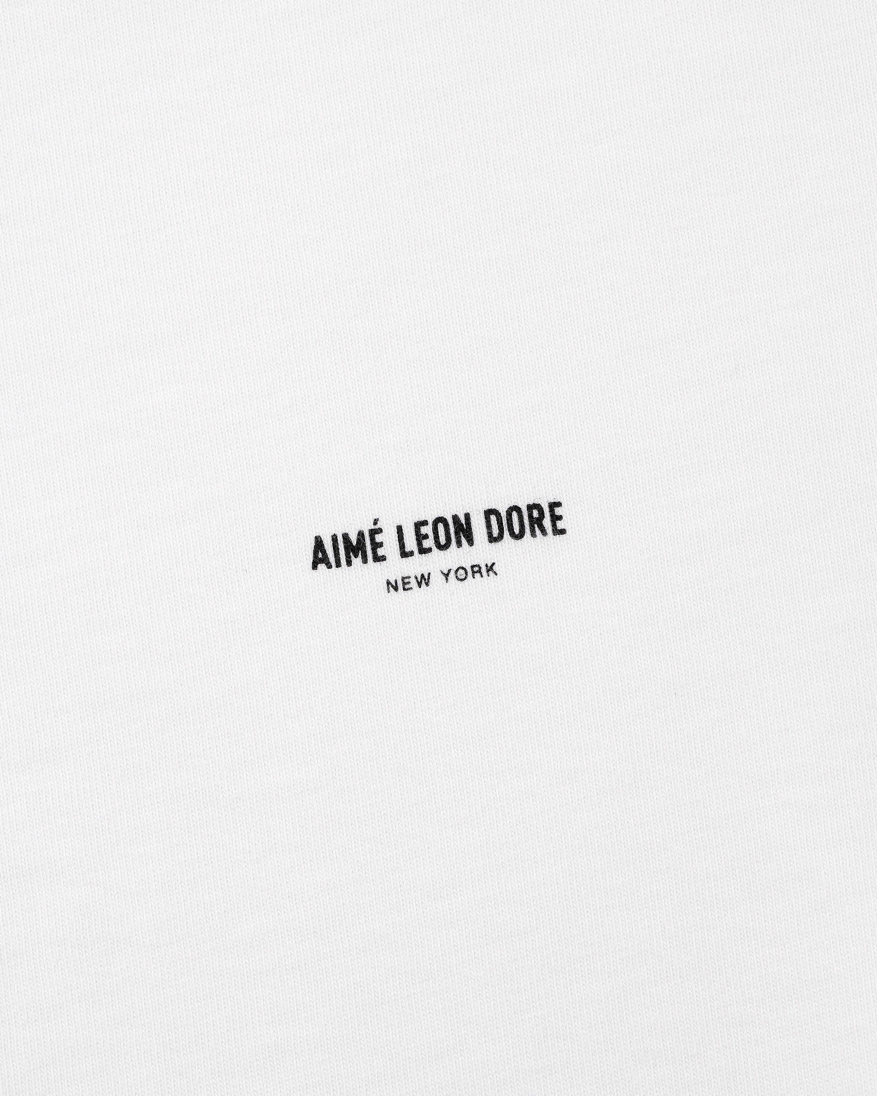 White Micro Logo Tee with black AIMÉ LEON DORE NEW YORK text printed at the center.