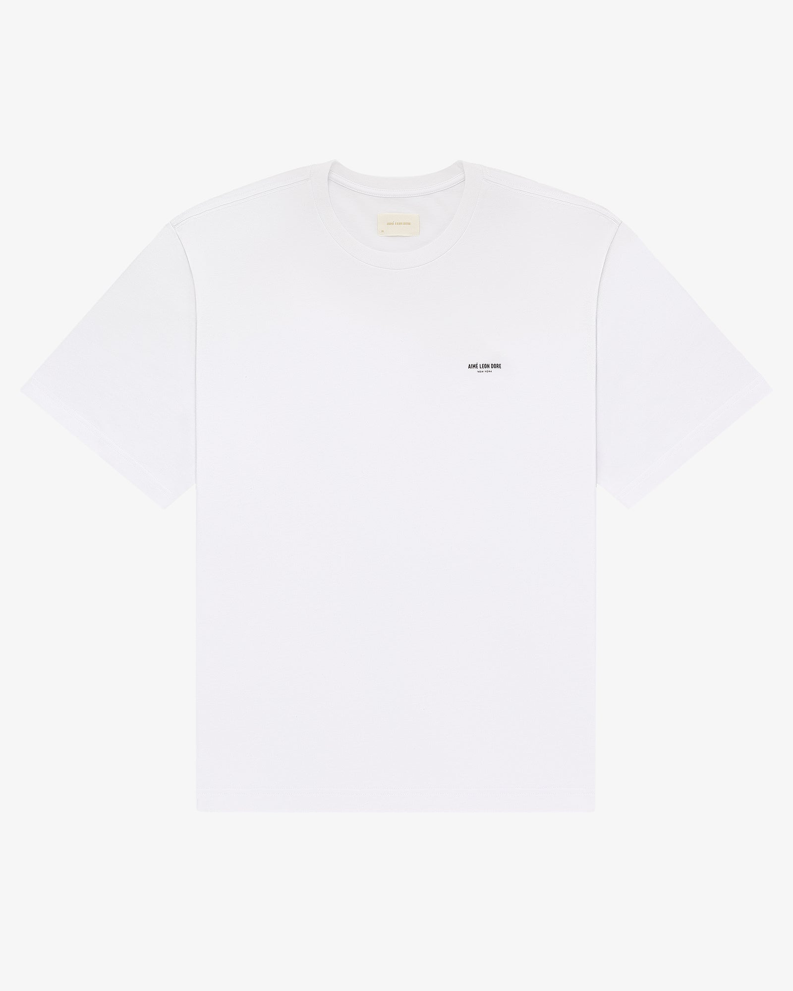 Micro Logo Tee: plain white short-sleeve t-shirt with a small black logo on the left chest.