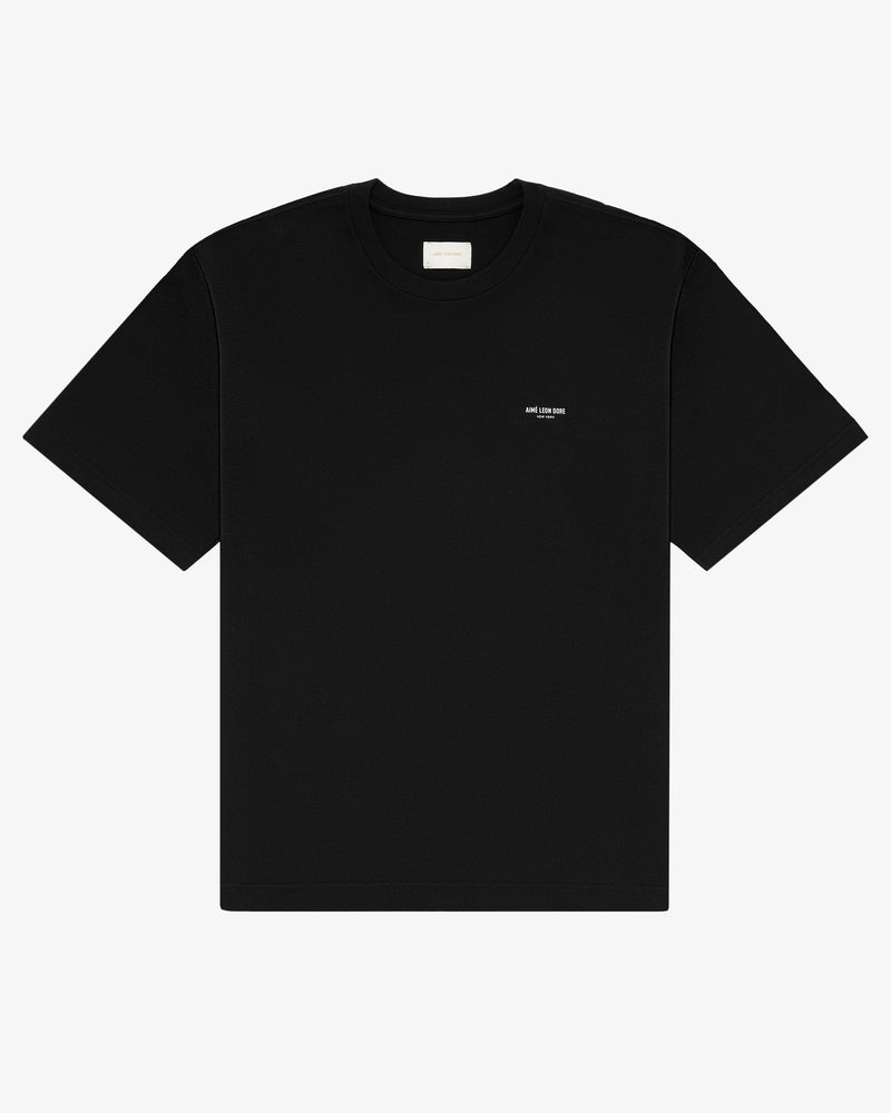 Micro Logo Tee: Black short-sleeve shirt with small white logo on left chest, shown on plain white background.