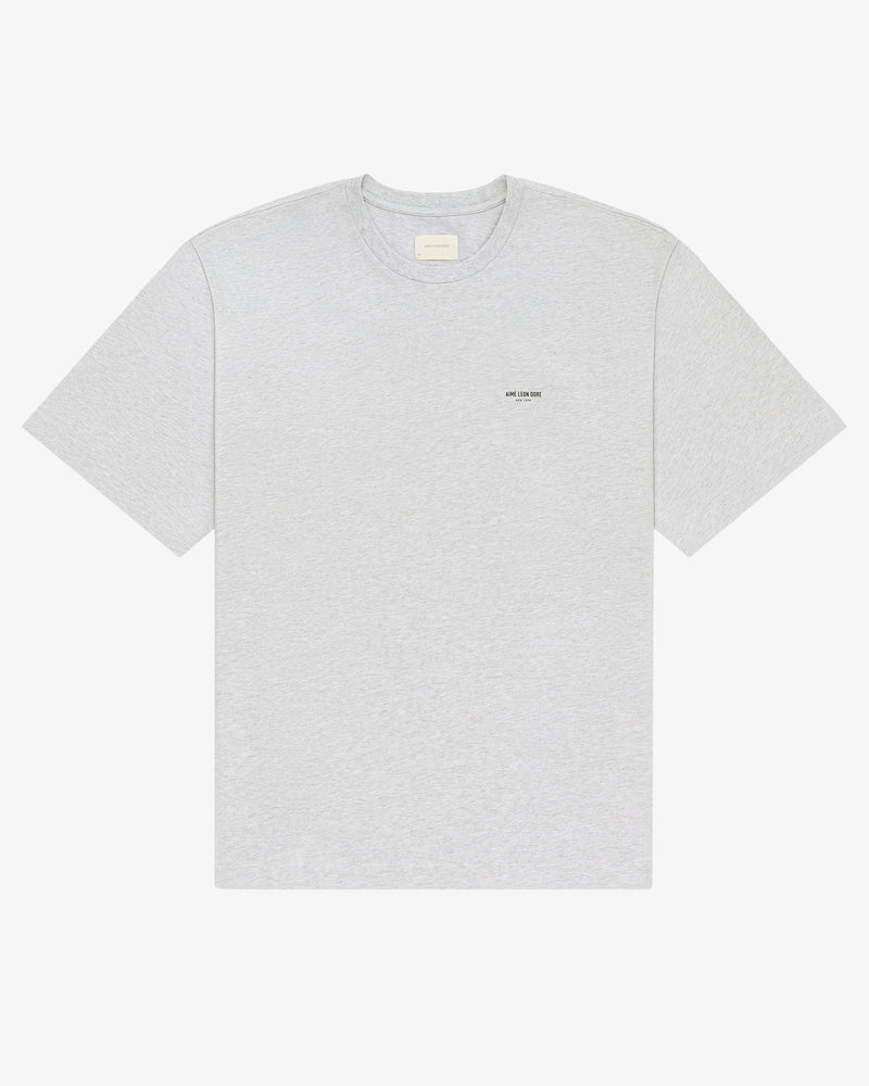 Light gray Micro Logo Tee with small black text on left chest, shown flat on a white background.