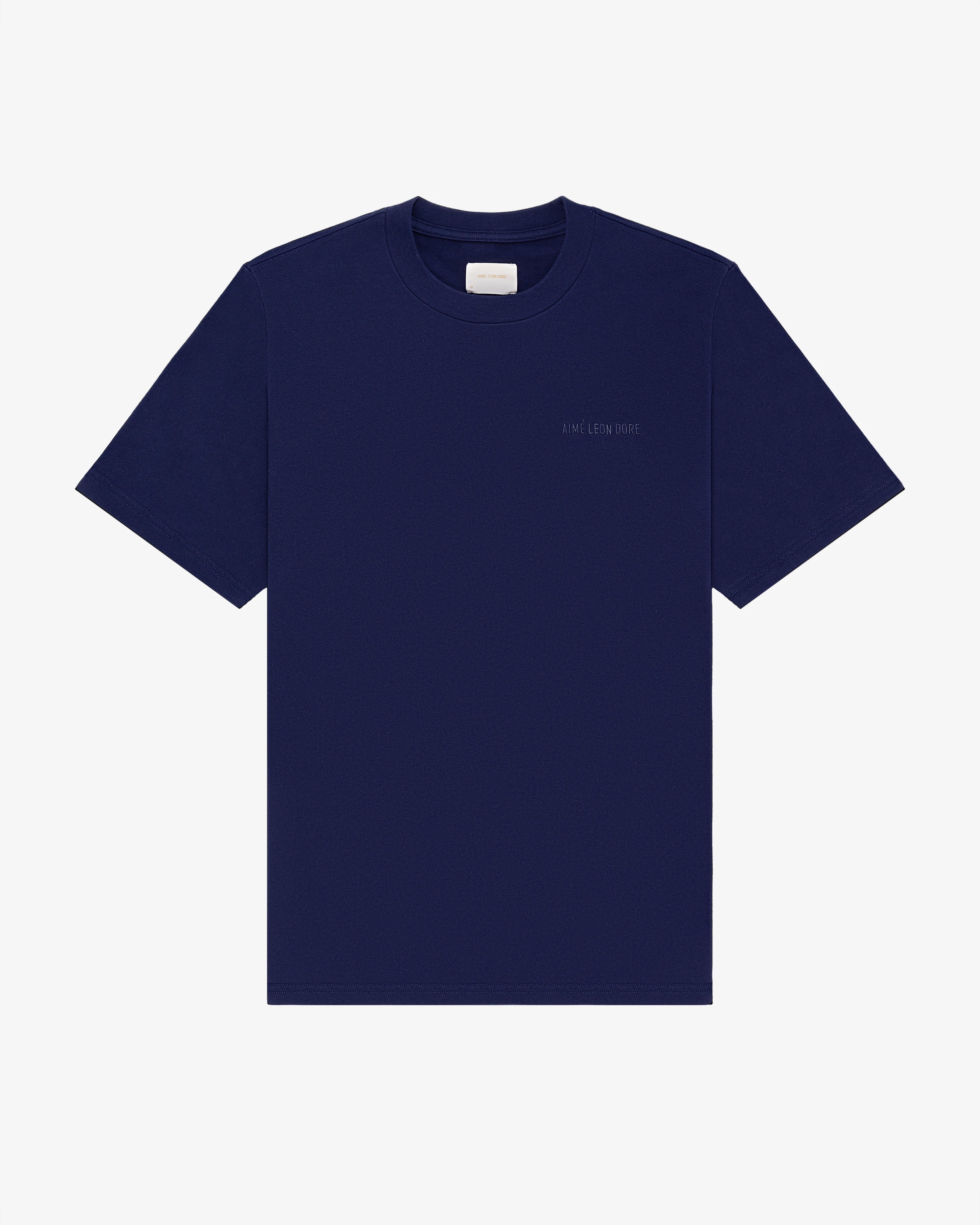 Navy Tonal Logo Tee, short sleeves, with a small white label inside the collar.