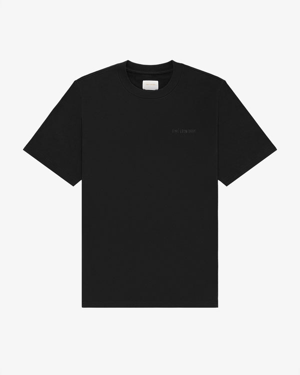 Tonal Logo Tee in plain black with subtle left chest text, short sleeves, shown on a white background.