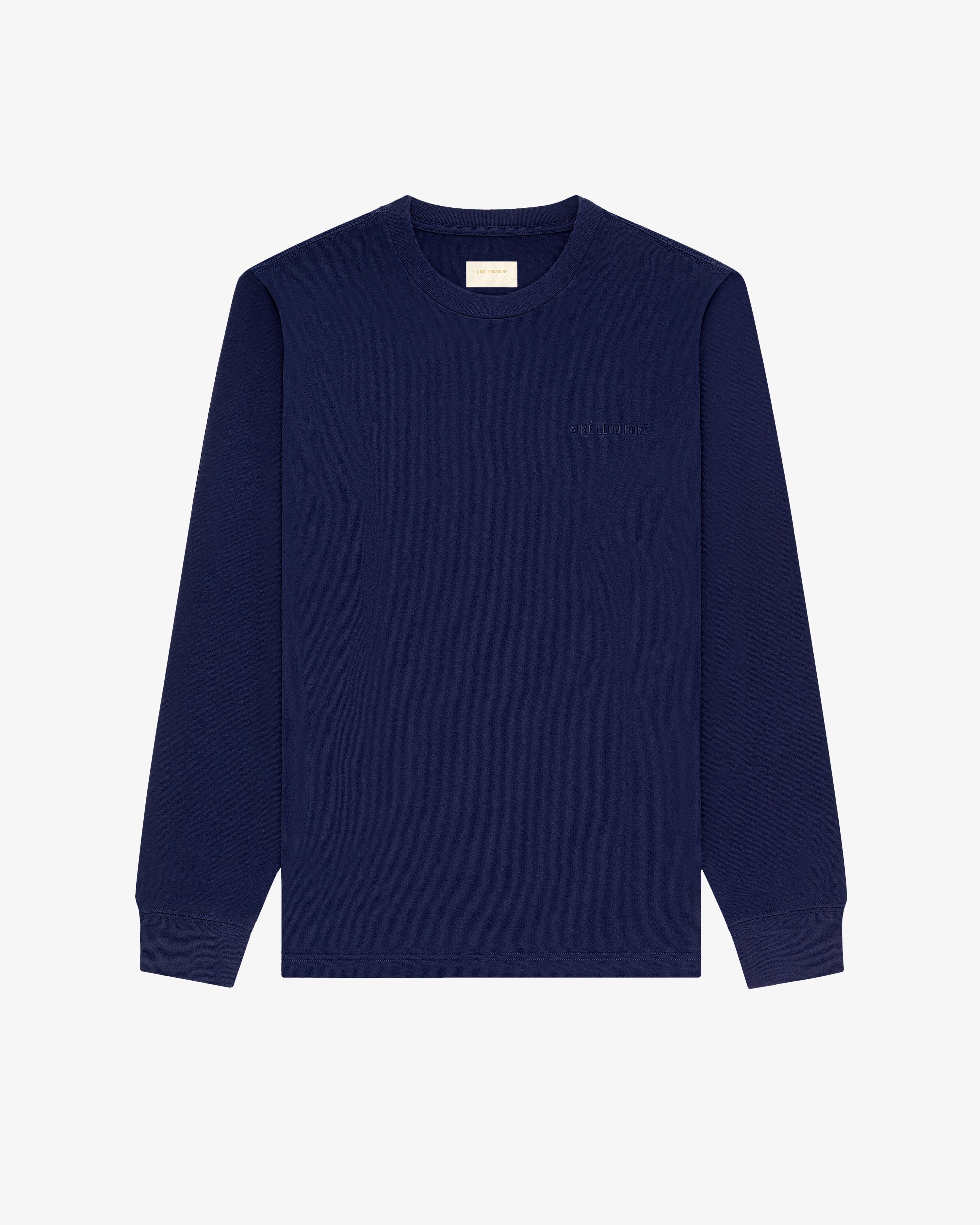 Long-Sleeve Tonal Logo Tee in navy blue with ribbed cuffs, displayed on a plain white background.