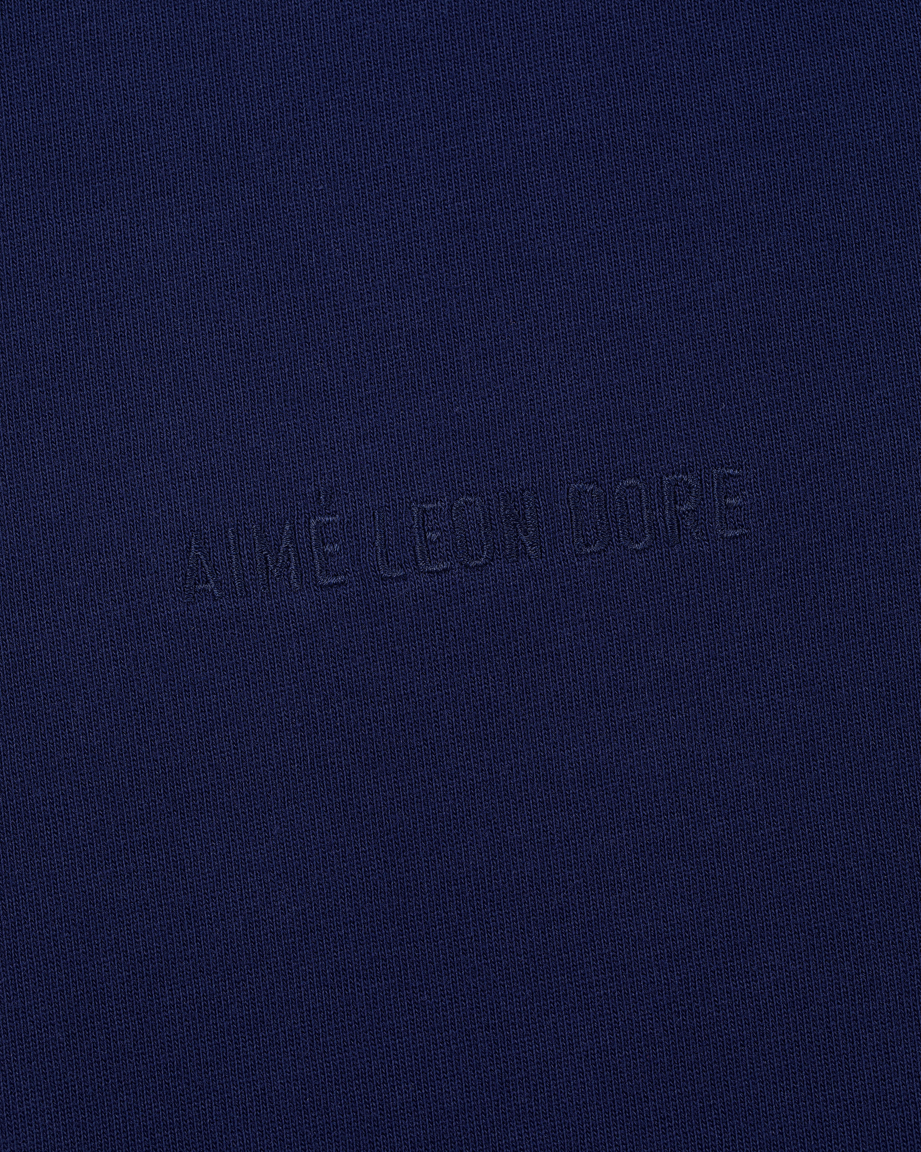 Navy blue Long-Sleeve Tonal Logo Tee with AIMÉ LEON DORE subtly embossed in the center.