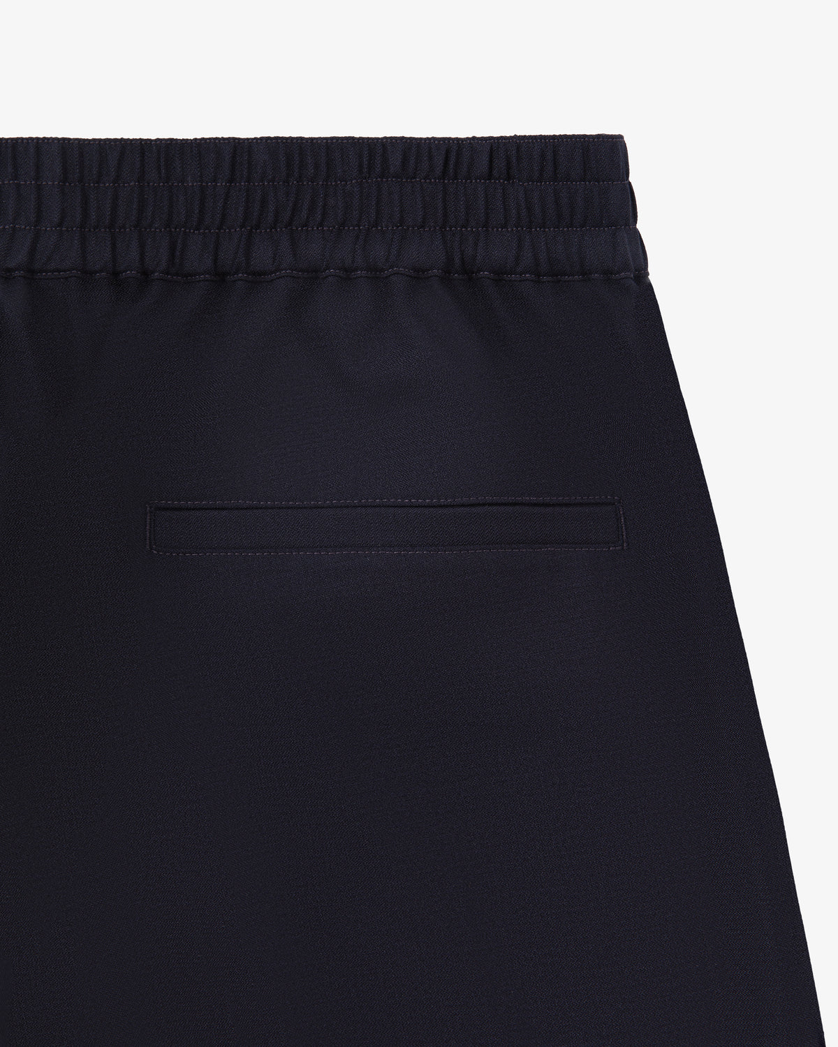 Close-up of the back of Tropical Wool Elasticated Waist Suit Trouser with an elastic waistband and single welt pocket.