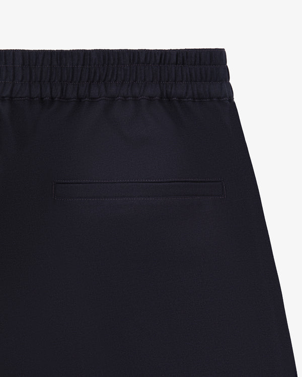 Close-up of the back of Tropical Wool Elasticated Waist Suit Trouser with an elastic waistband and single welt pocket.