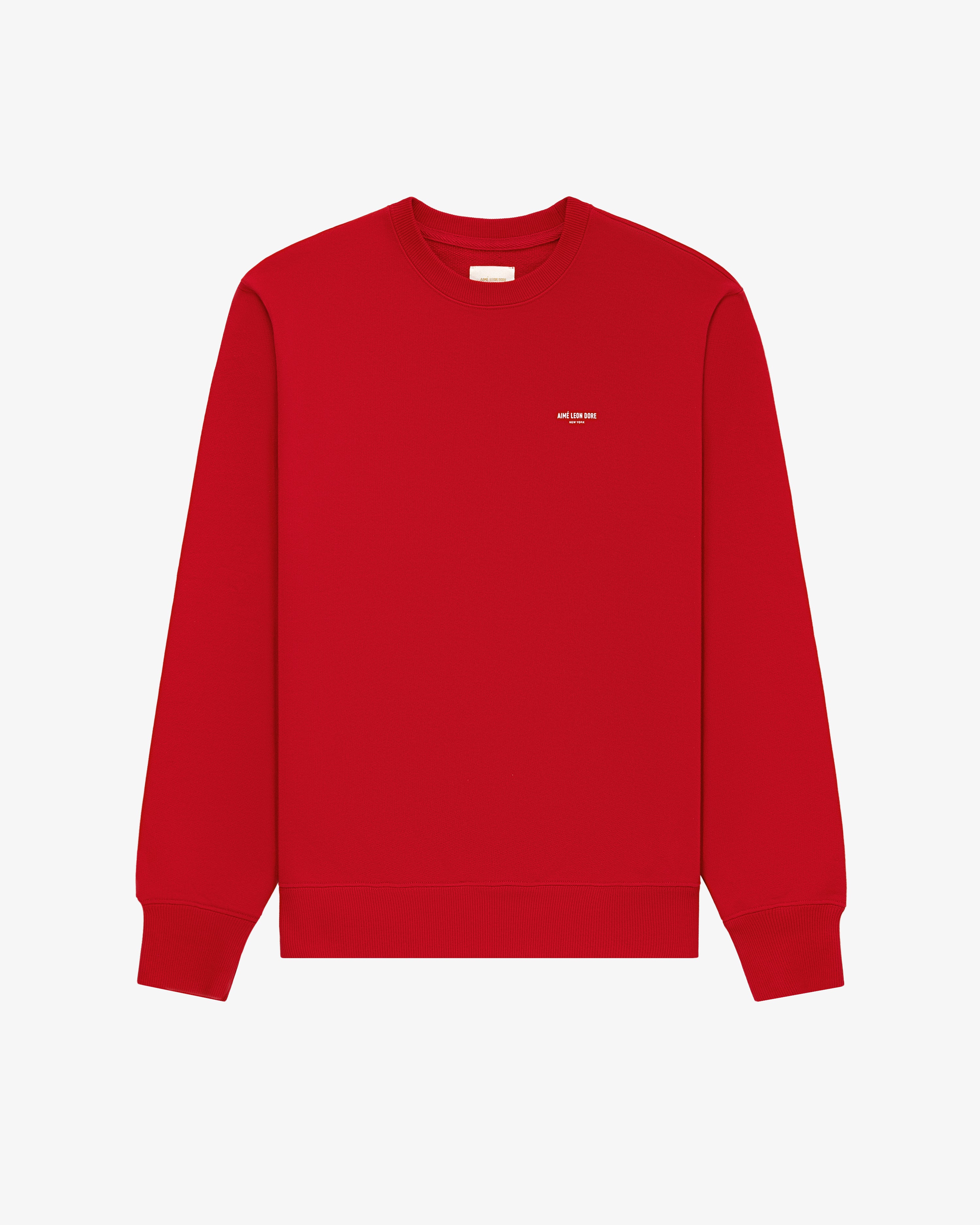 Micro Logo Crewneck Sweatshirt in red with small white chest text, shown on a plain white background.