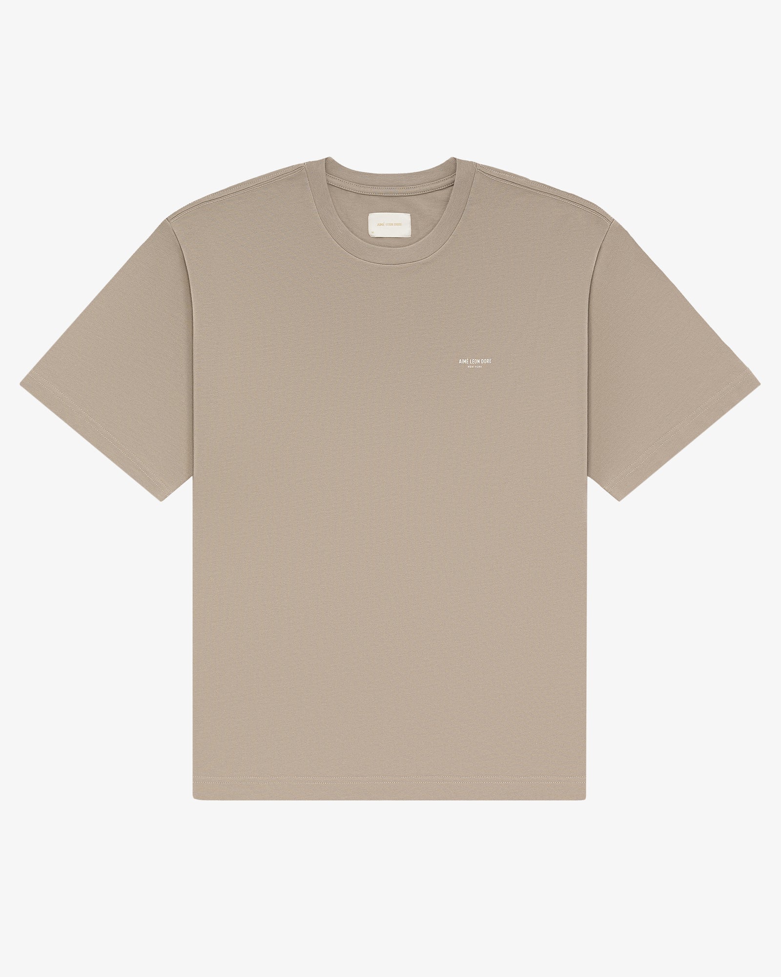 Micro Logo Tee in beige with a small white chest logo, shown on a plain white background.