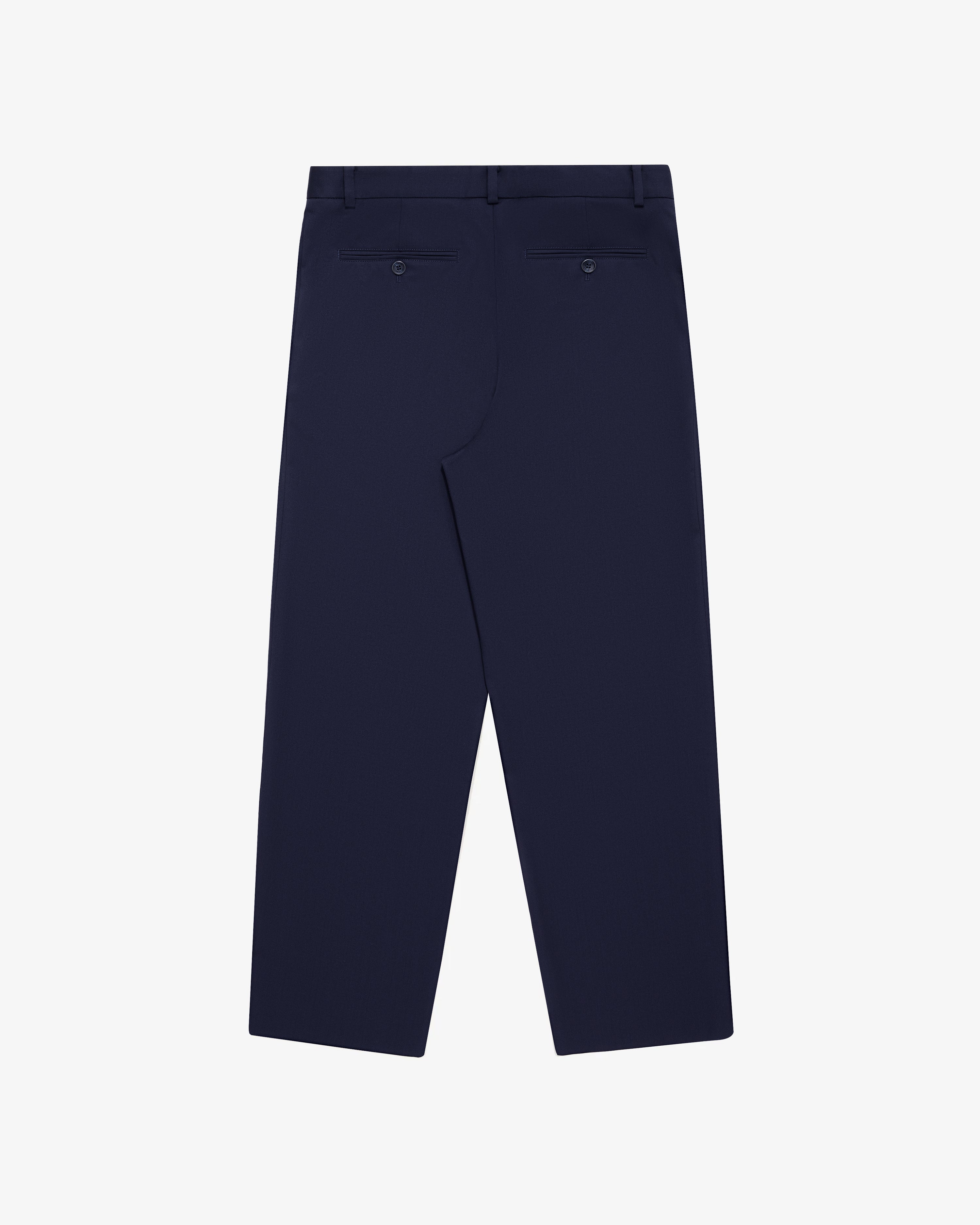 Single-Pleated Gabardine Trouser in navy, shown from the back with two buttoned welt pockets and straight leg cut.
