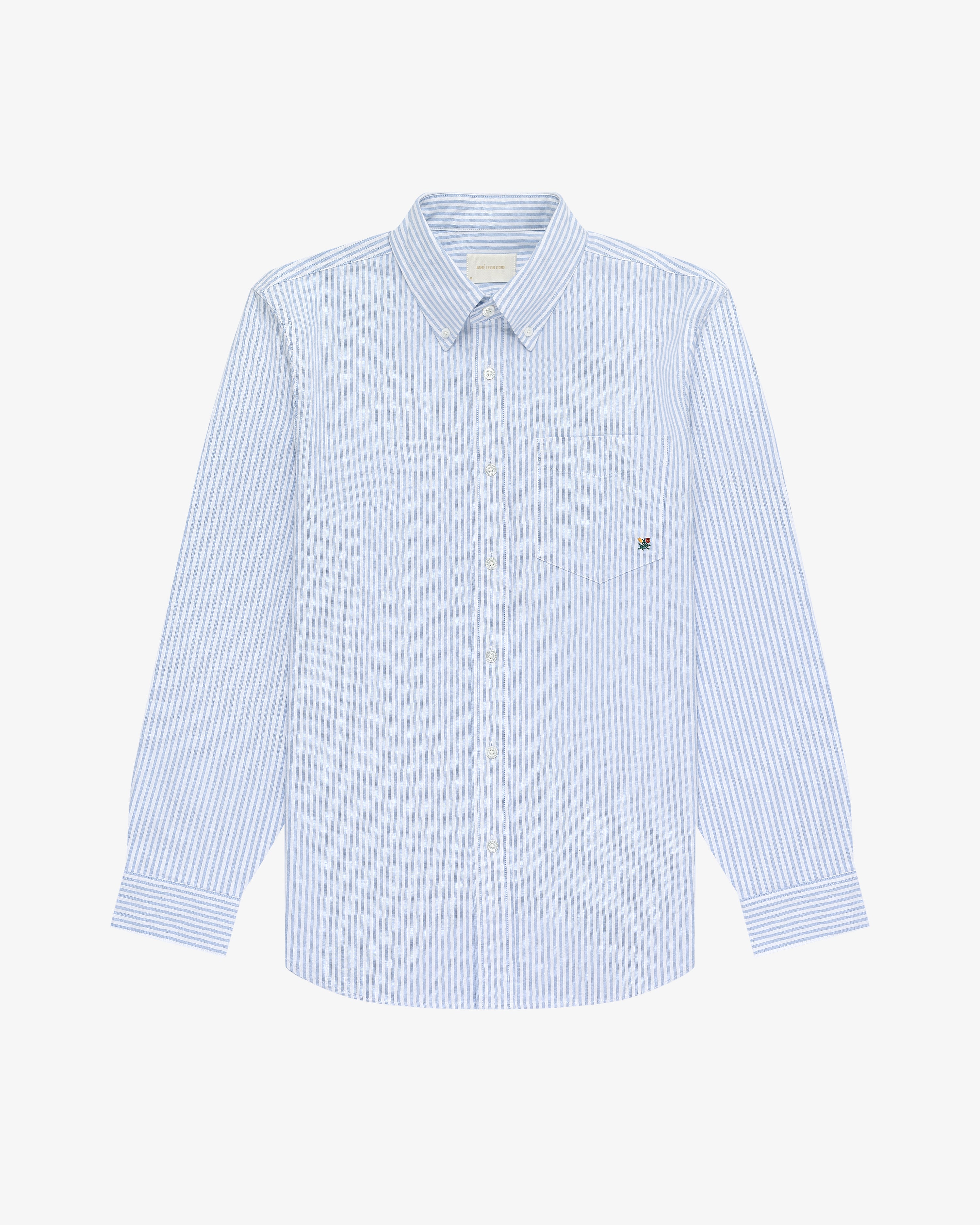 Striped Crest Oxford Shirt in light blue and white with long sleeves and chest pocket, on a white background.