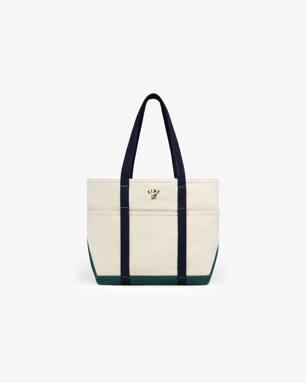 Large Crest Contrast Tote Bag with navy handles, green base, and small embroidered front-center design.