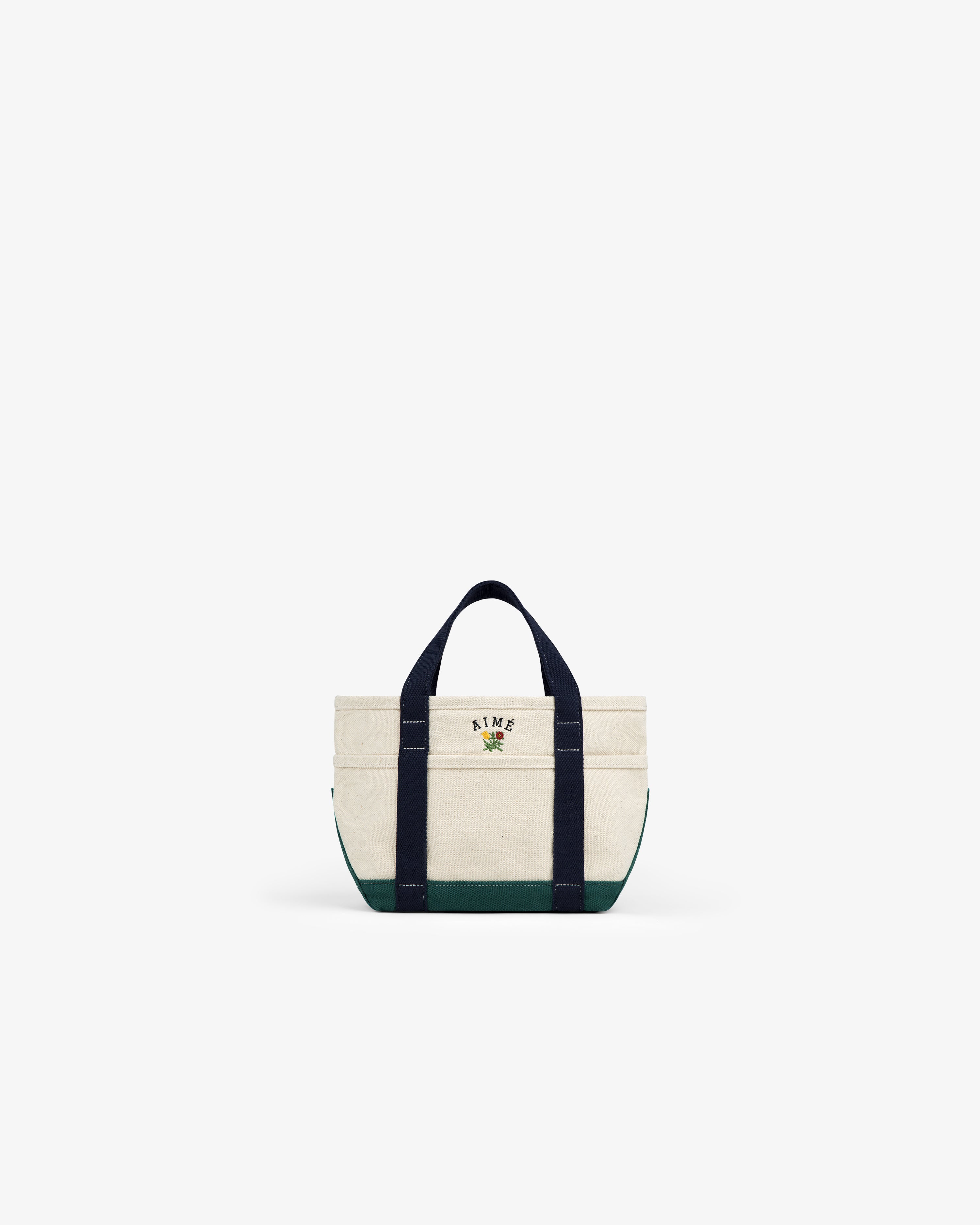 Mini Crest Contrast Tote Bag with dark handles, green base, and AIME text with graphic on the front.