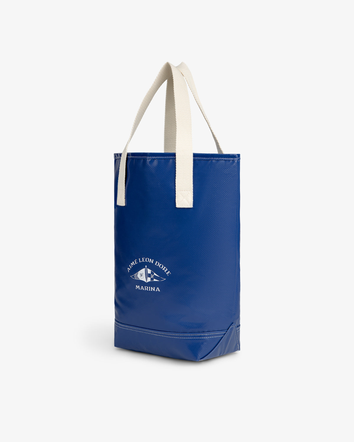 Marina Bottle Tote in blue with cream handles and white Aimé Leon Dore Marina logo on the front.