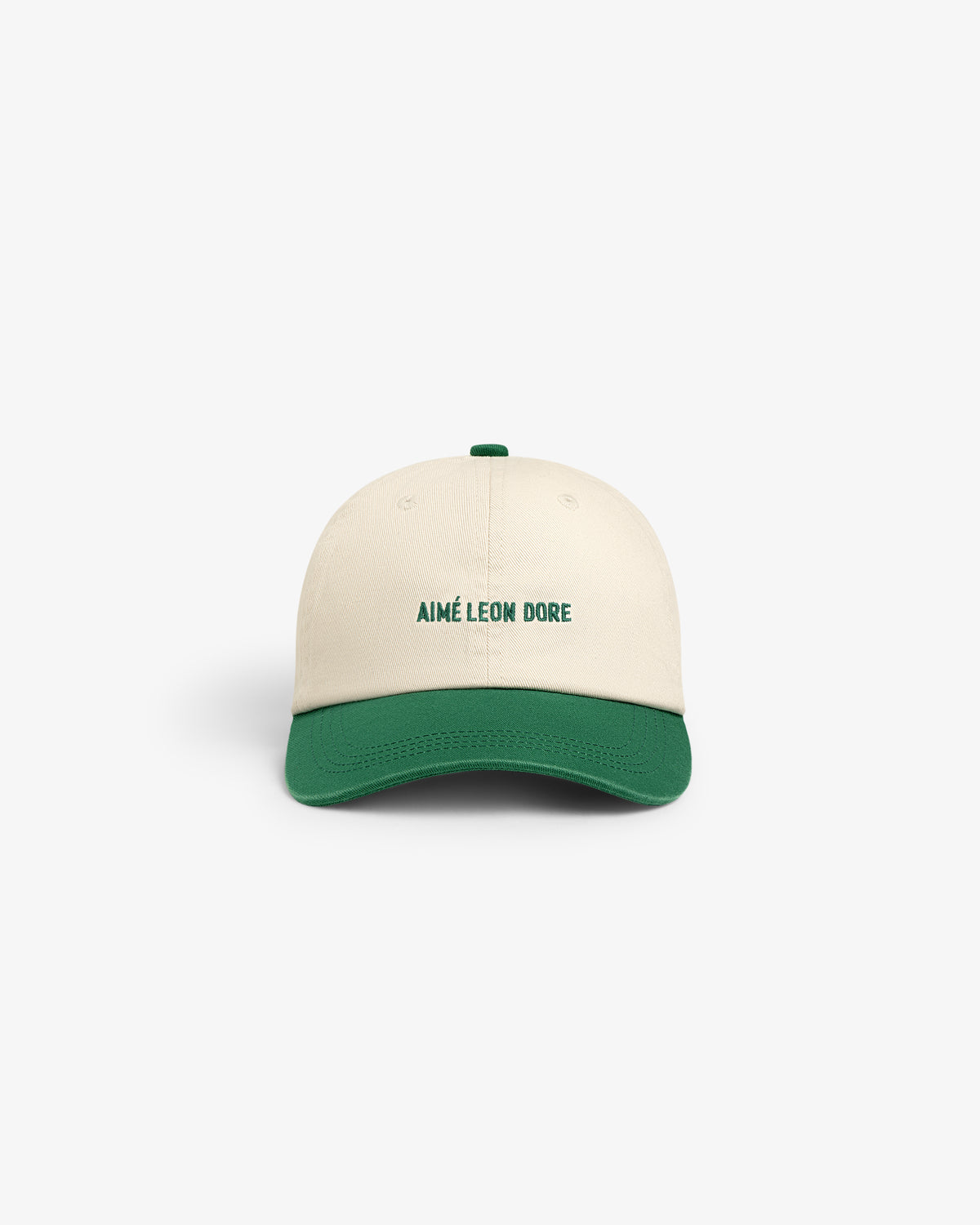 Washed Chino Hat in cream with green brim and AIMÉ LEON DORE text embroidered on the front, shown front-facing.