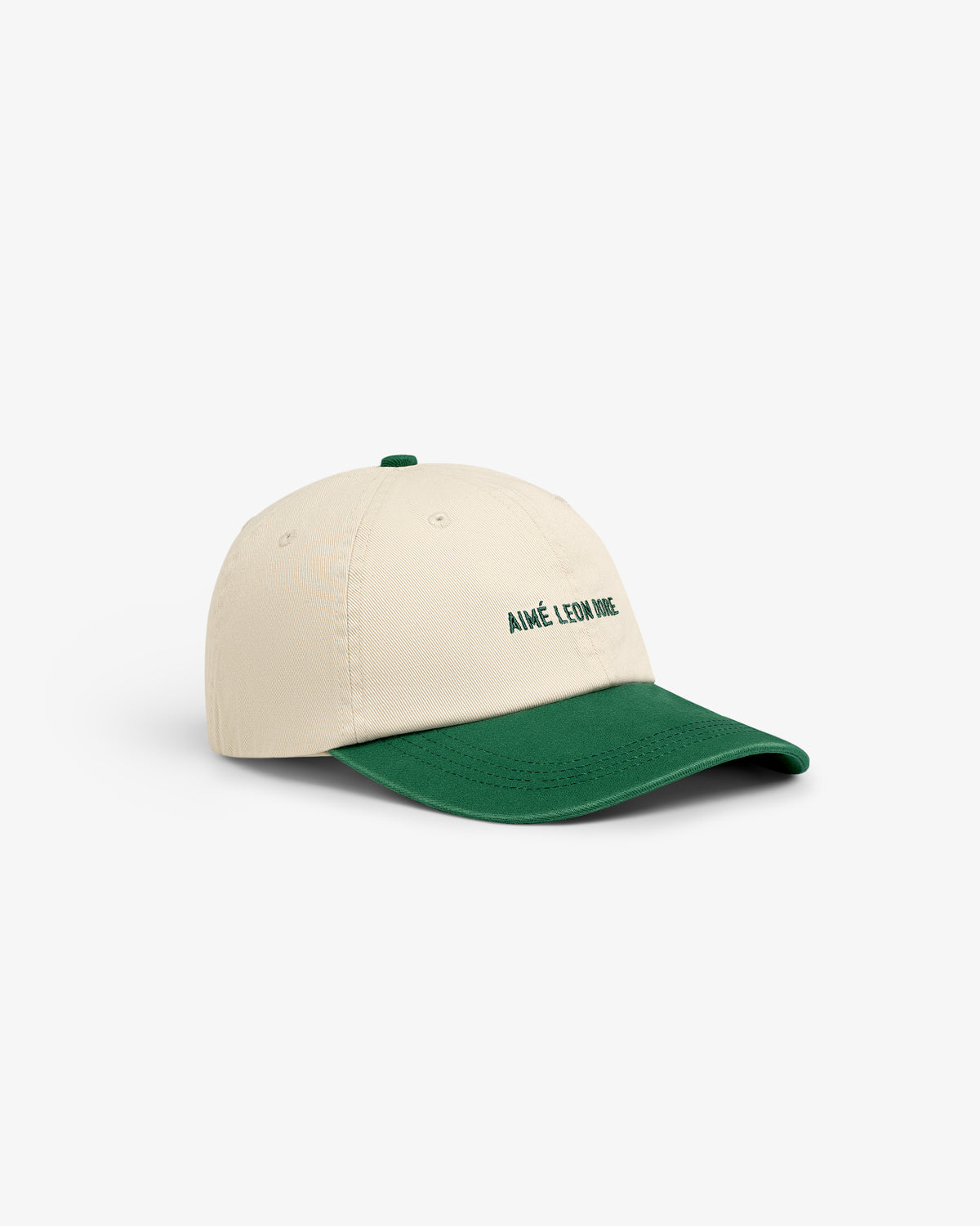 Washed Chino Hat: Beige cap with green brim and AIMÉ LEON DORE embroidered in green on the front.