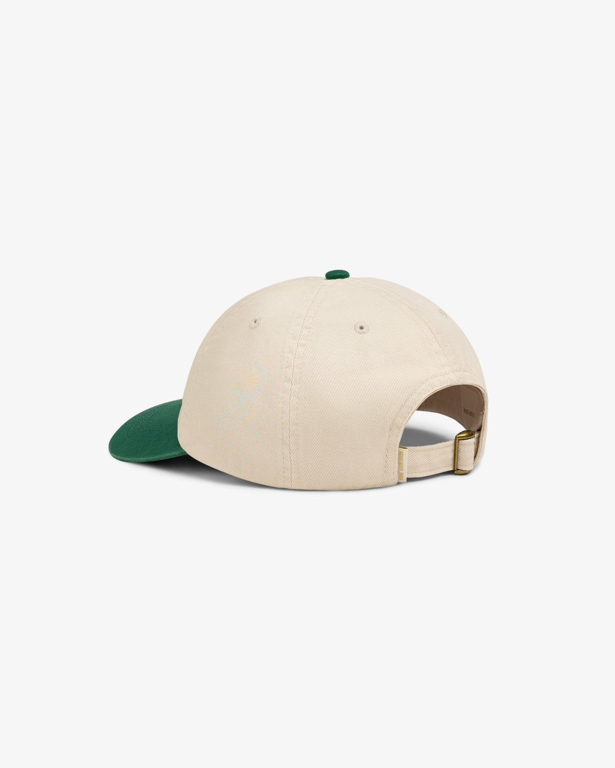 Washed Chino Hat in beige with a green brim, shown from the back with adjustable strap and metal buckle.