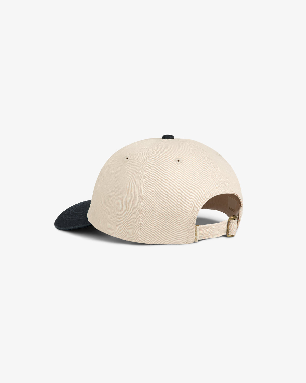 Washed Chino Hat in beige with black brim, shown from the back, features adjustable strap and buckle.